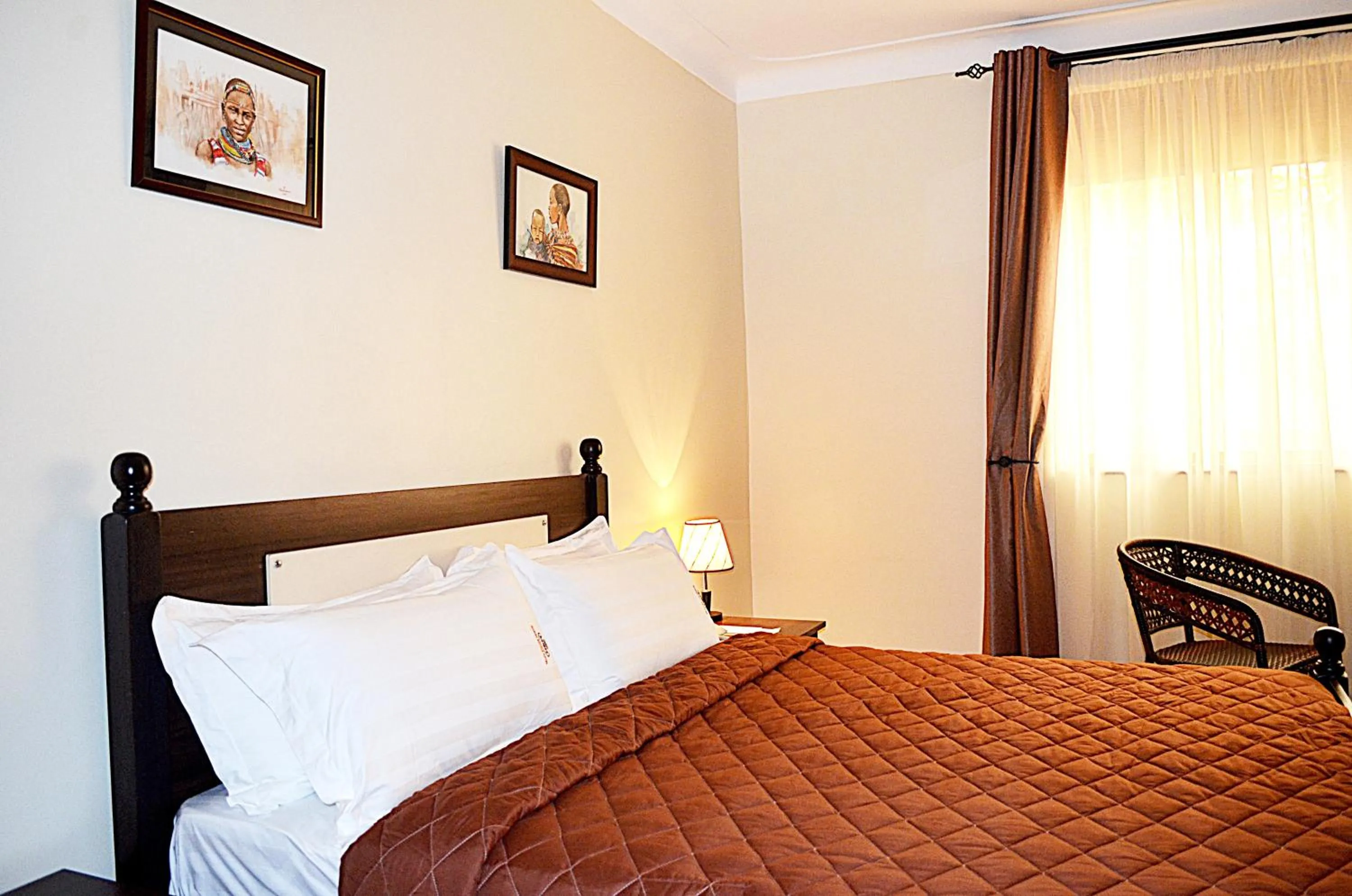 Bed in Marie's Royale Hotel