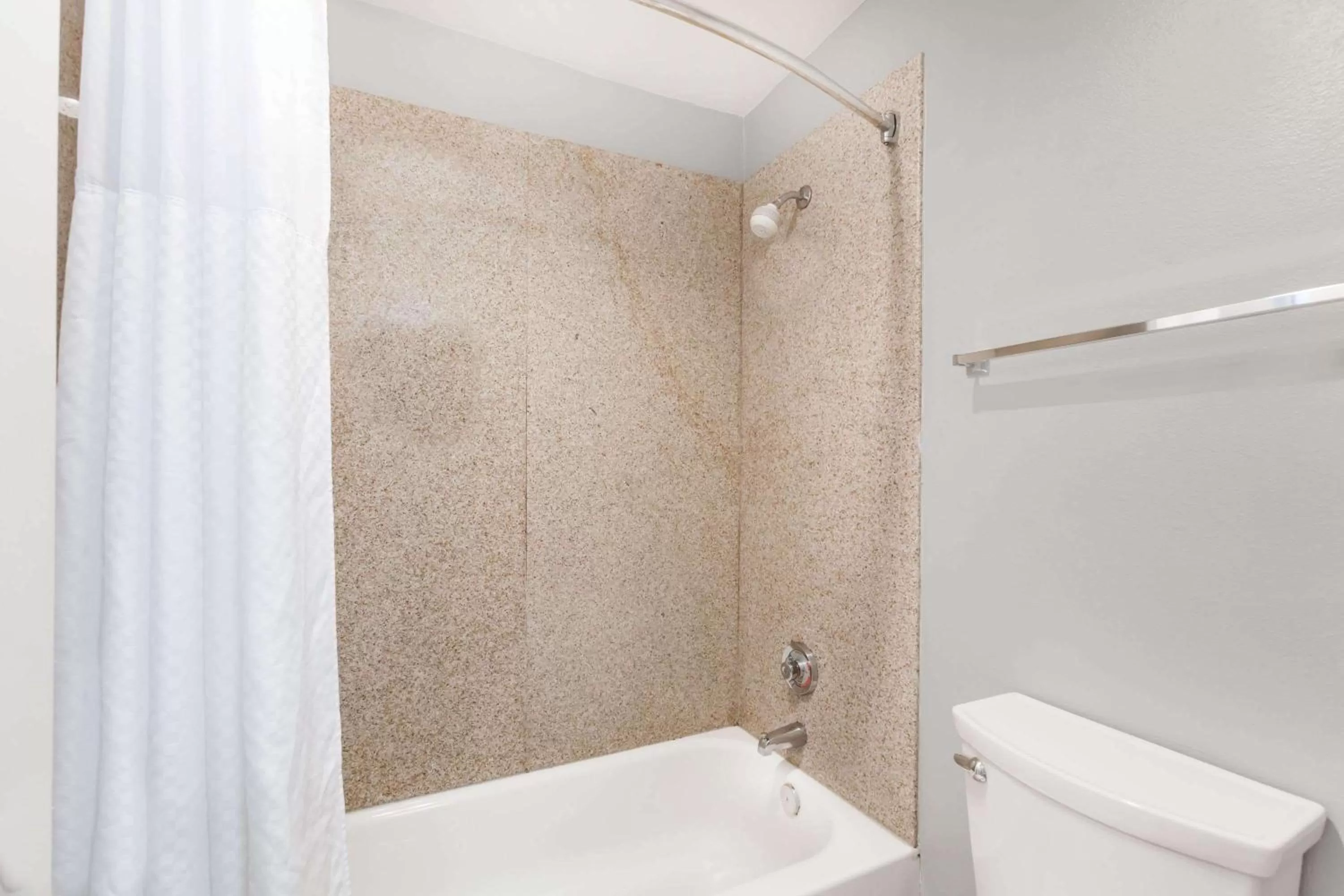 Bathroom in Days Inn by Wyndham Austin/University/Downtown