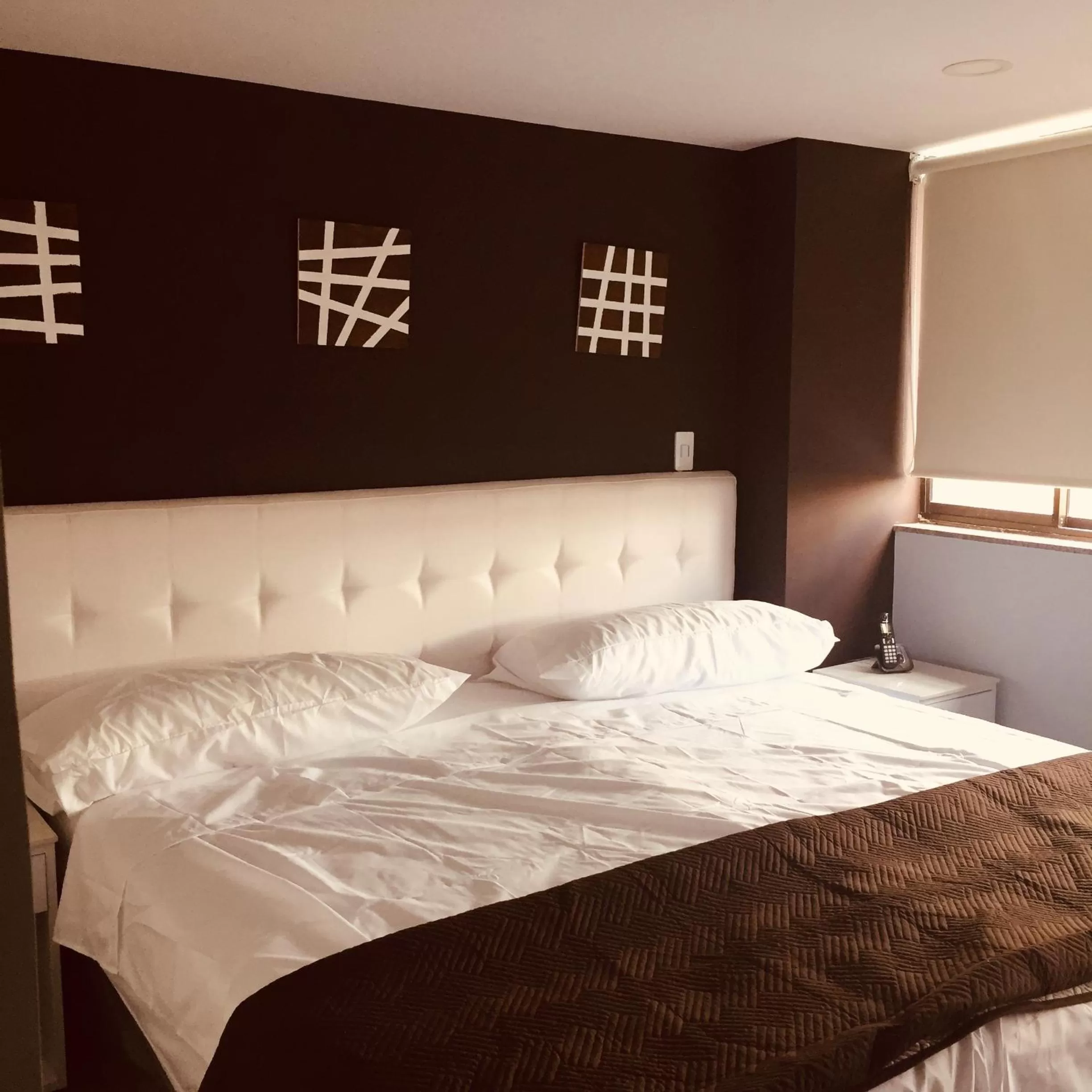 Bed in Hotel Garden City Boutique