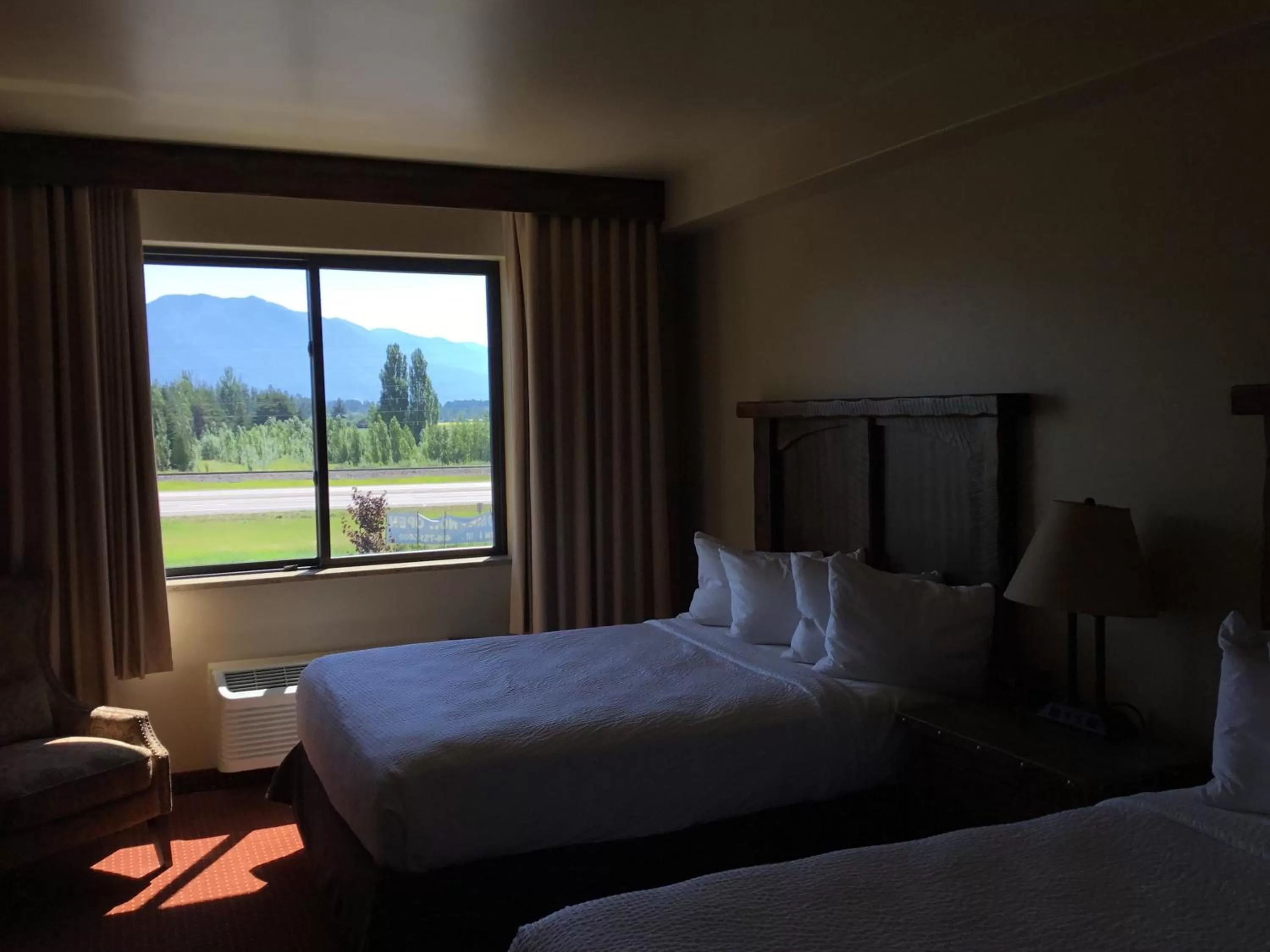 Bed in Glacier International Lodge