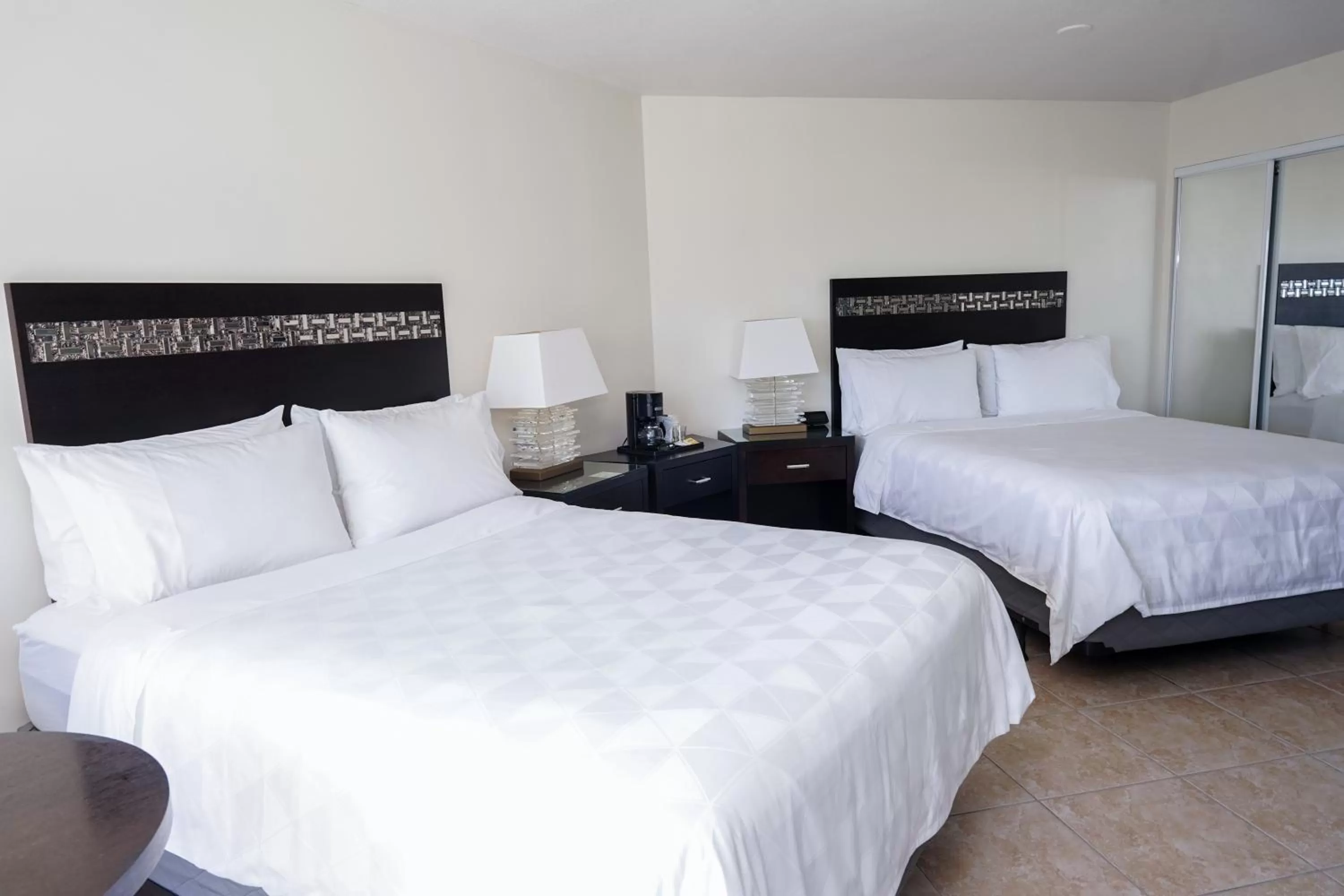 Bed in Holiday Inn Resort Grand Cayman by IHG