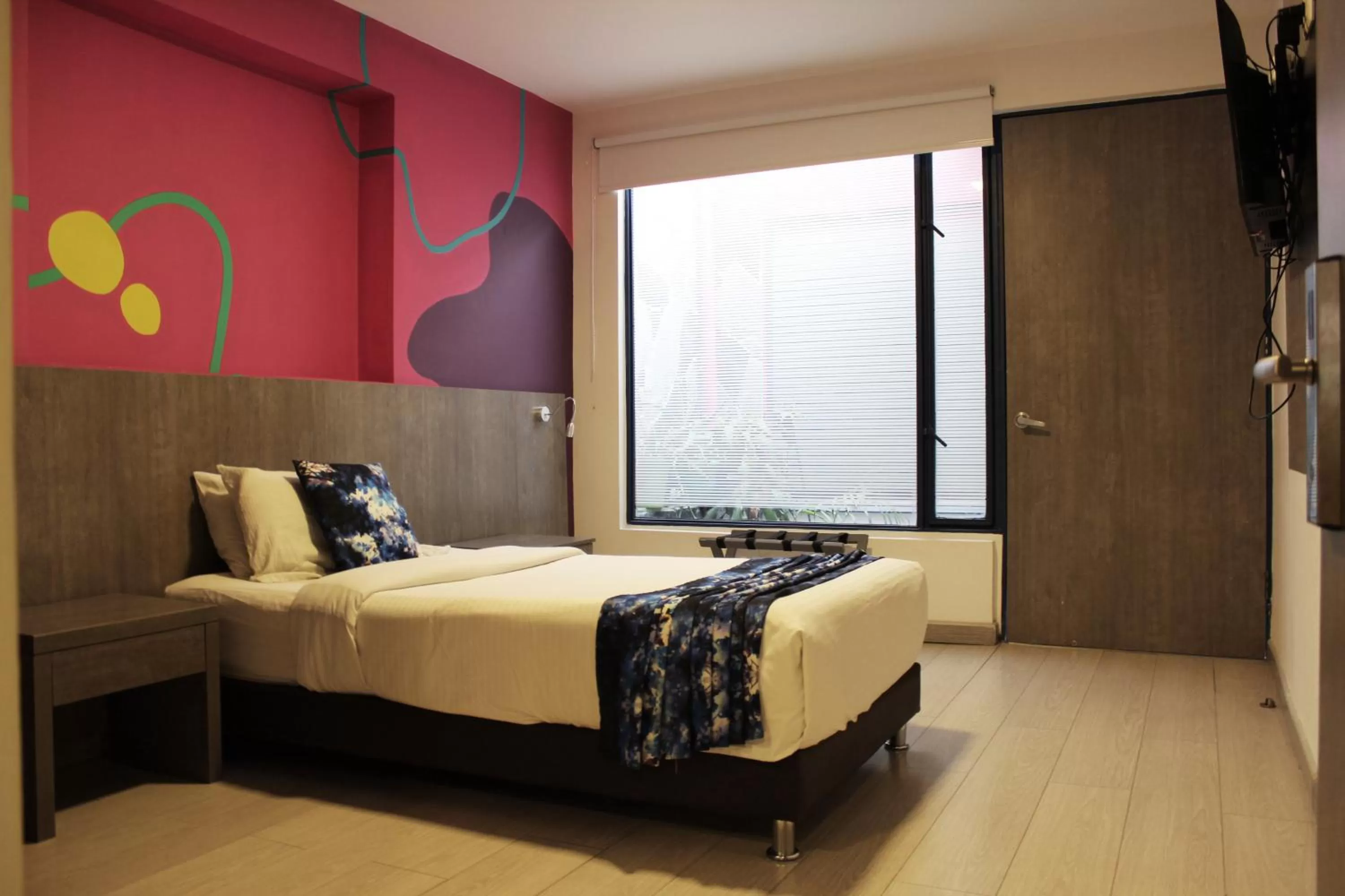 Bed in Agora Suites Self-Service Boutique Hotel