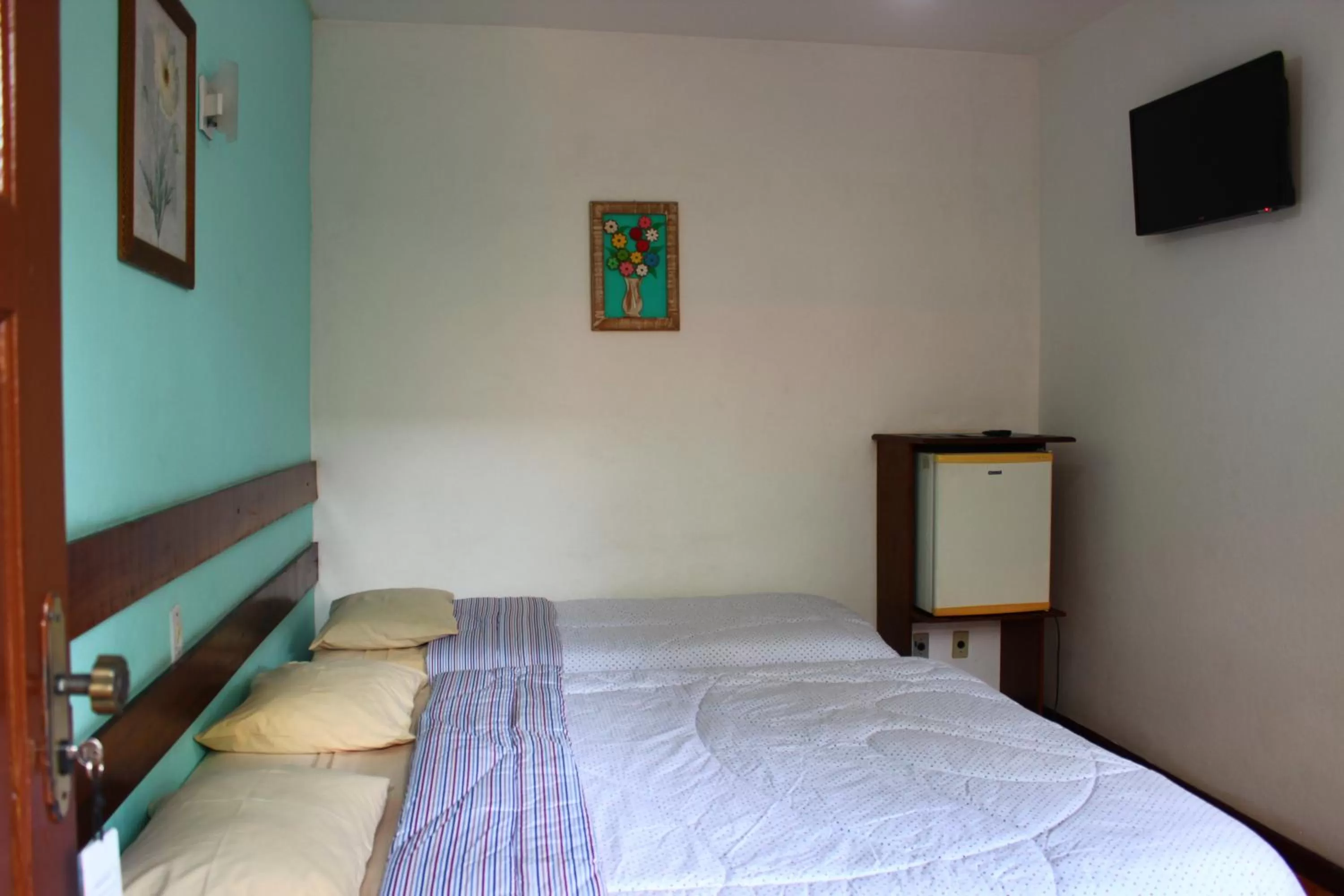 Bed in Pousada Flor de Paraty