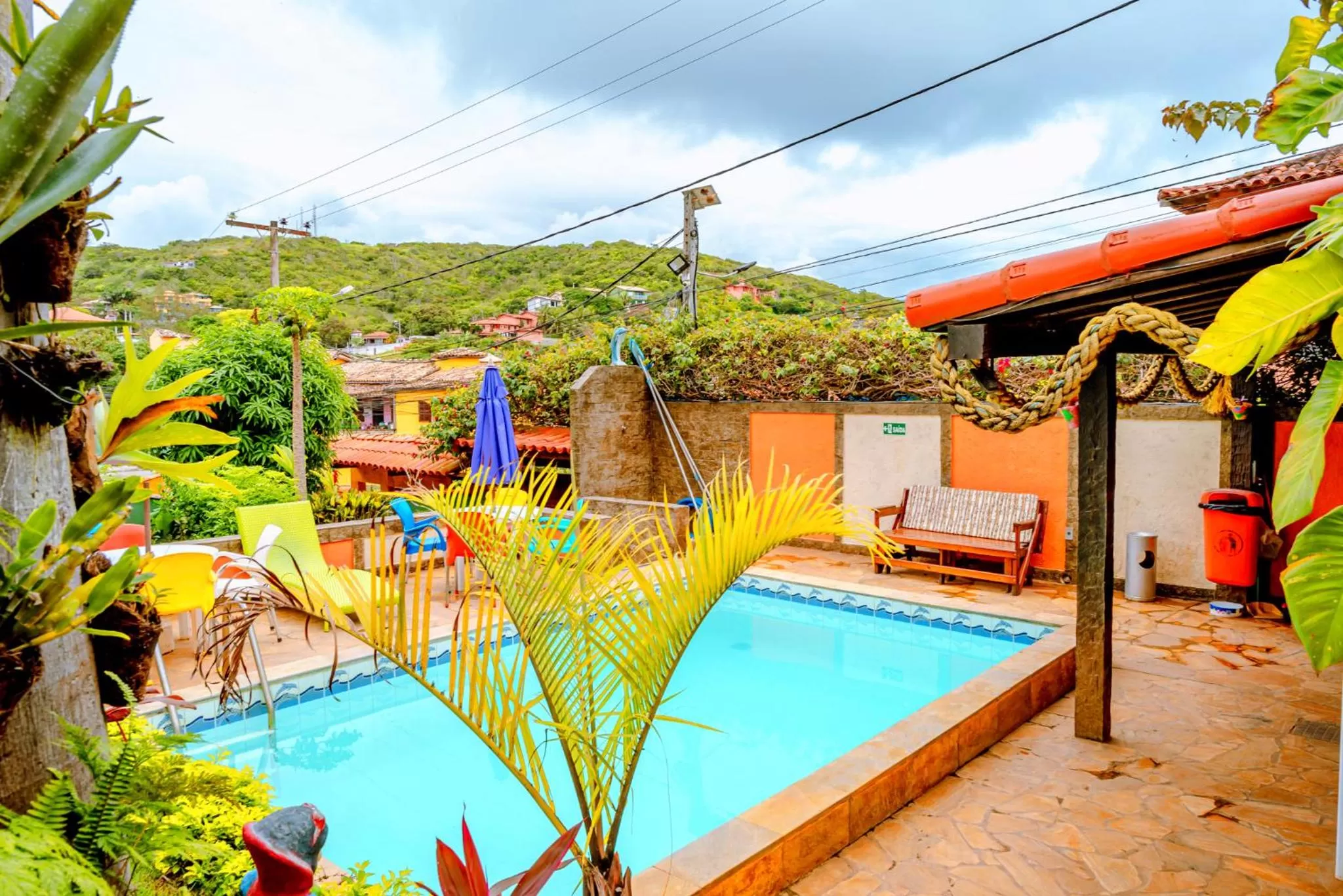 Swimming pool in Suítes Casa do Barão
