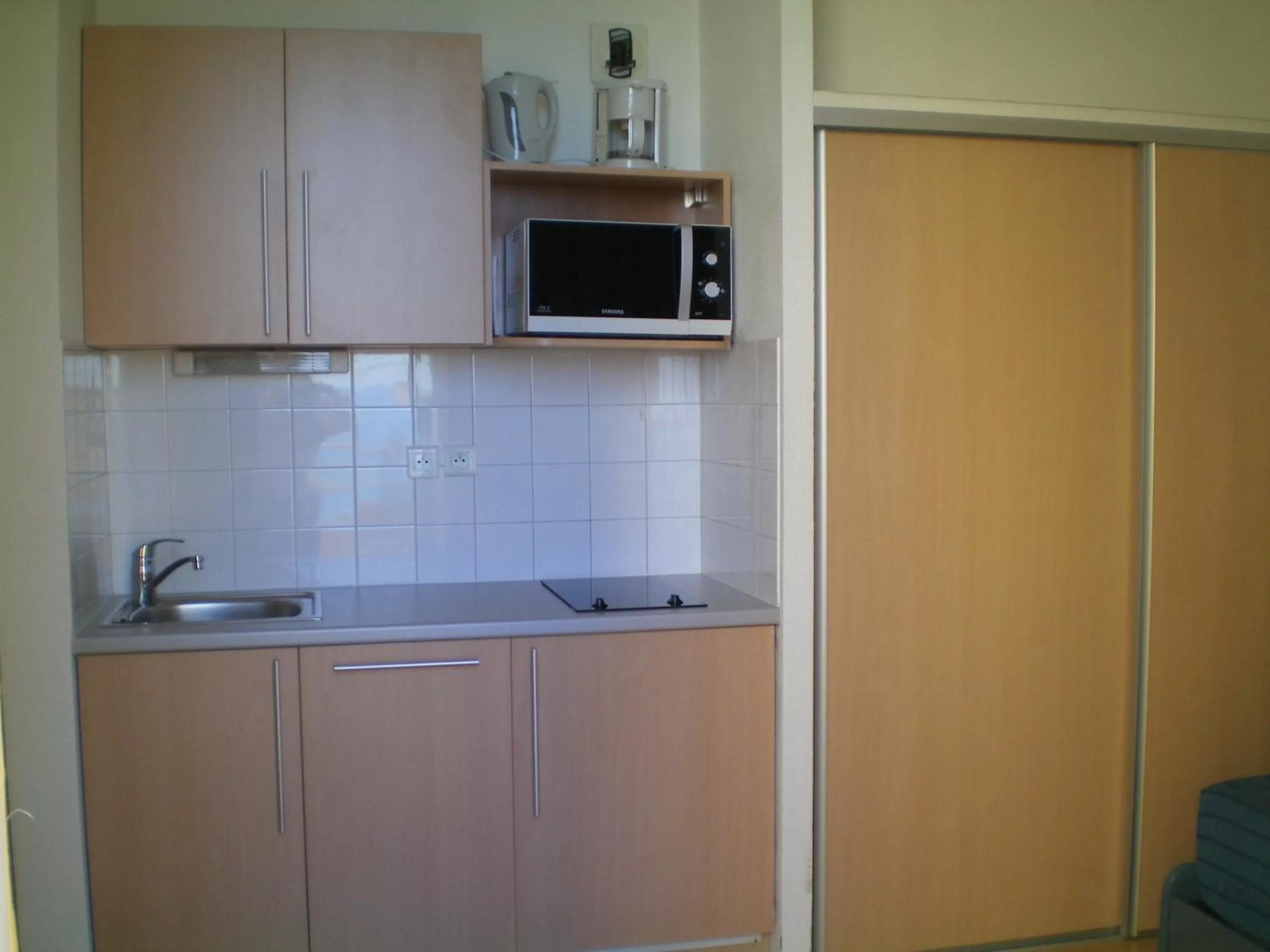 Kitchen or kitchenette in Résidence Mer & Golf Eugénie