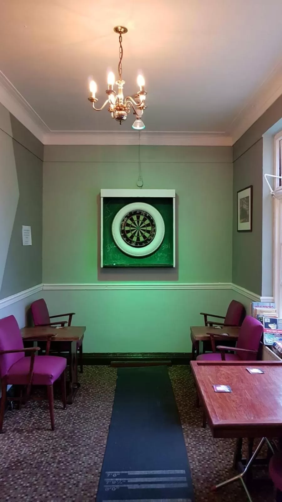 Communal lounge/ TV room in Hour Glass Hotel