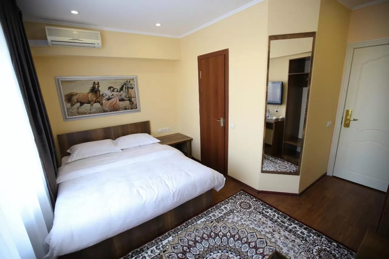 Bed in Altai Business Hotel