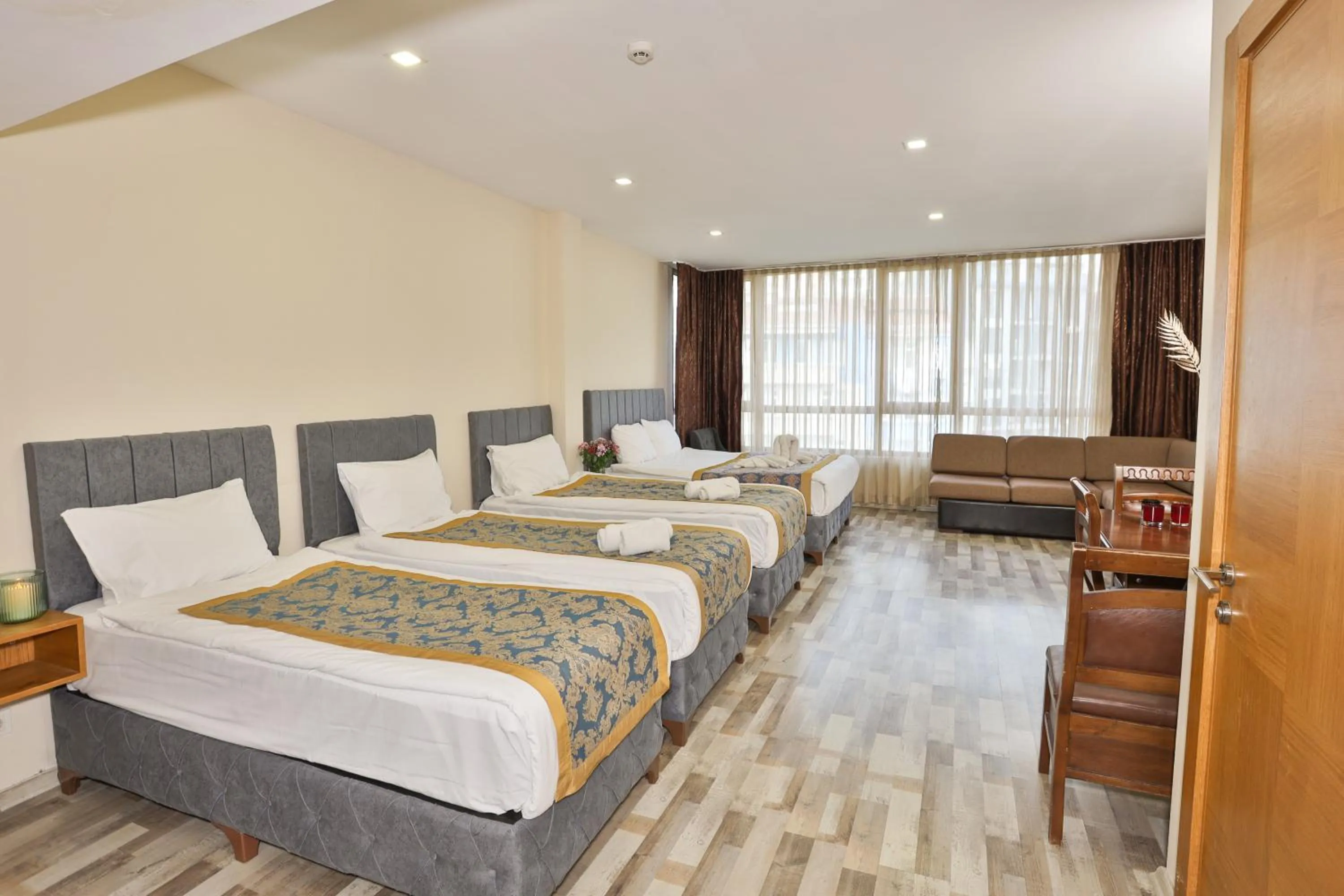 Seating area, Bed in Cumbali Plaza Hotel