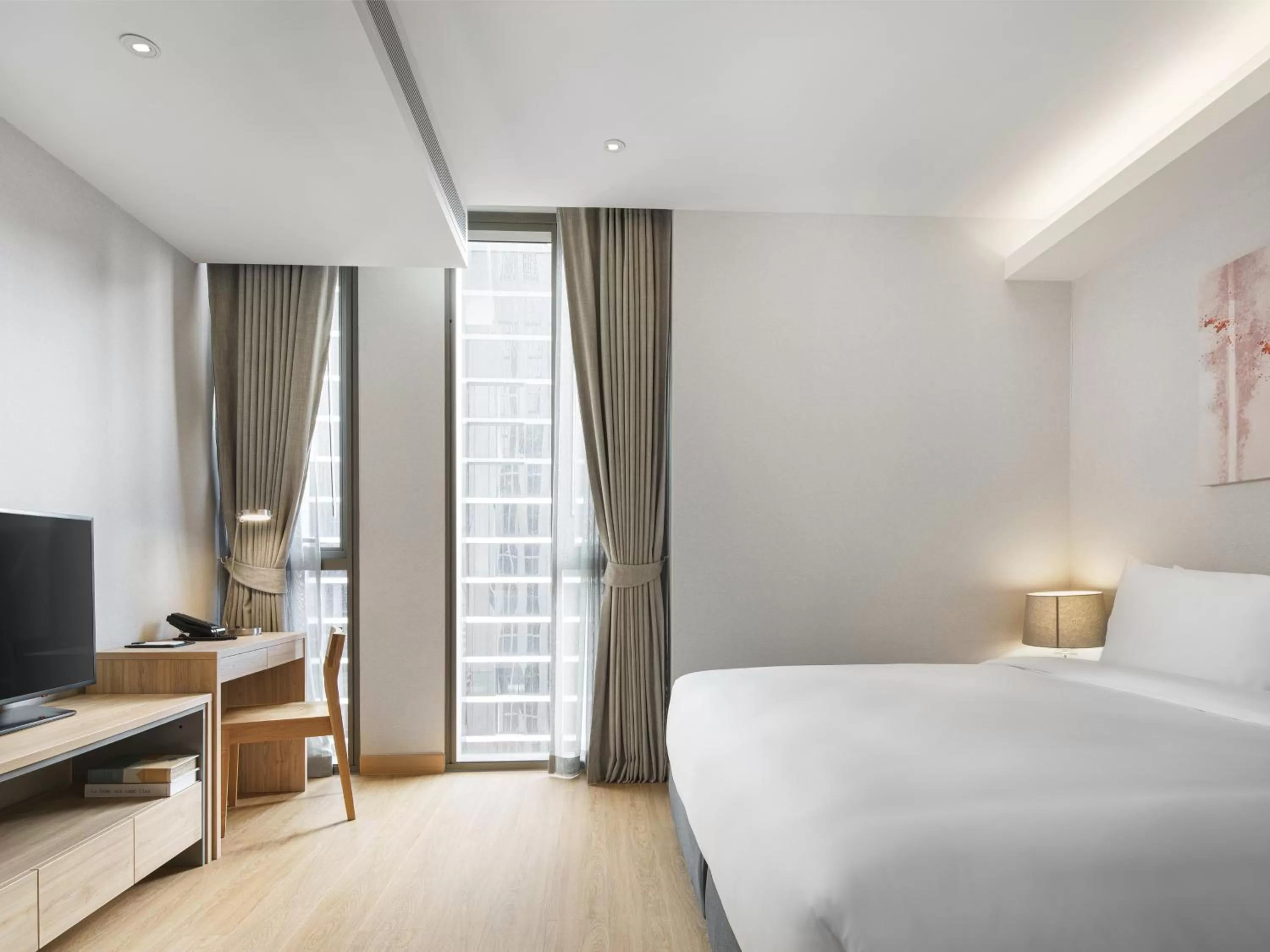 Bed in Oakwood Suites Bangkok