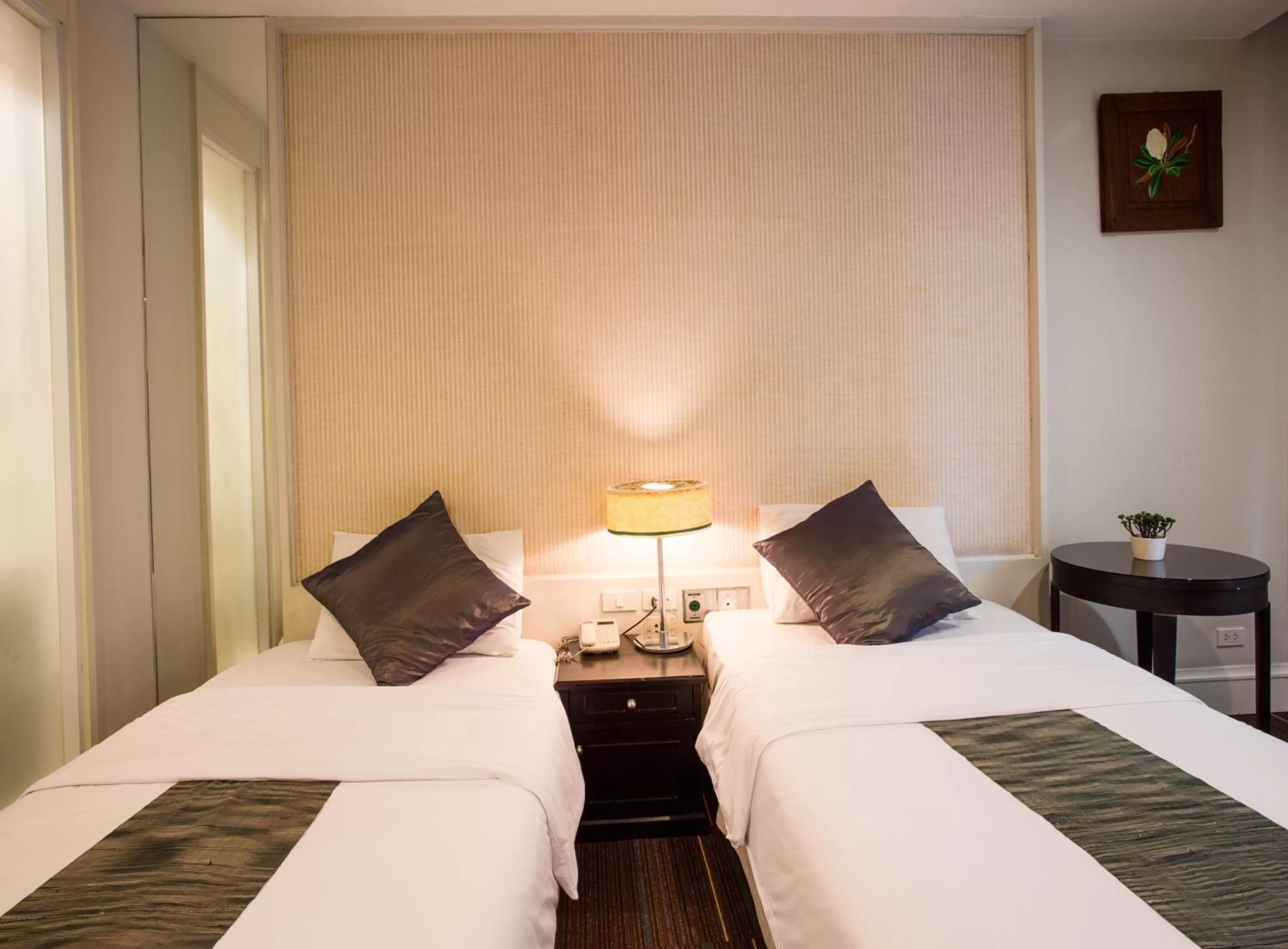 Bed in Aphrodite Inn Bangkok