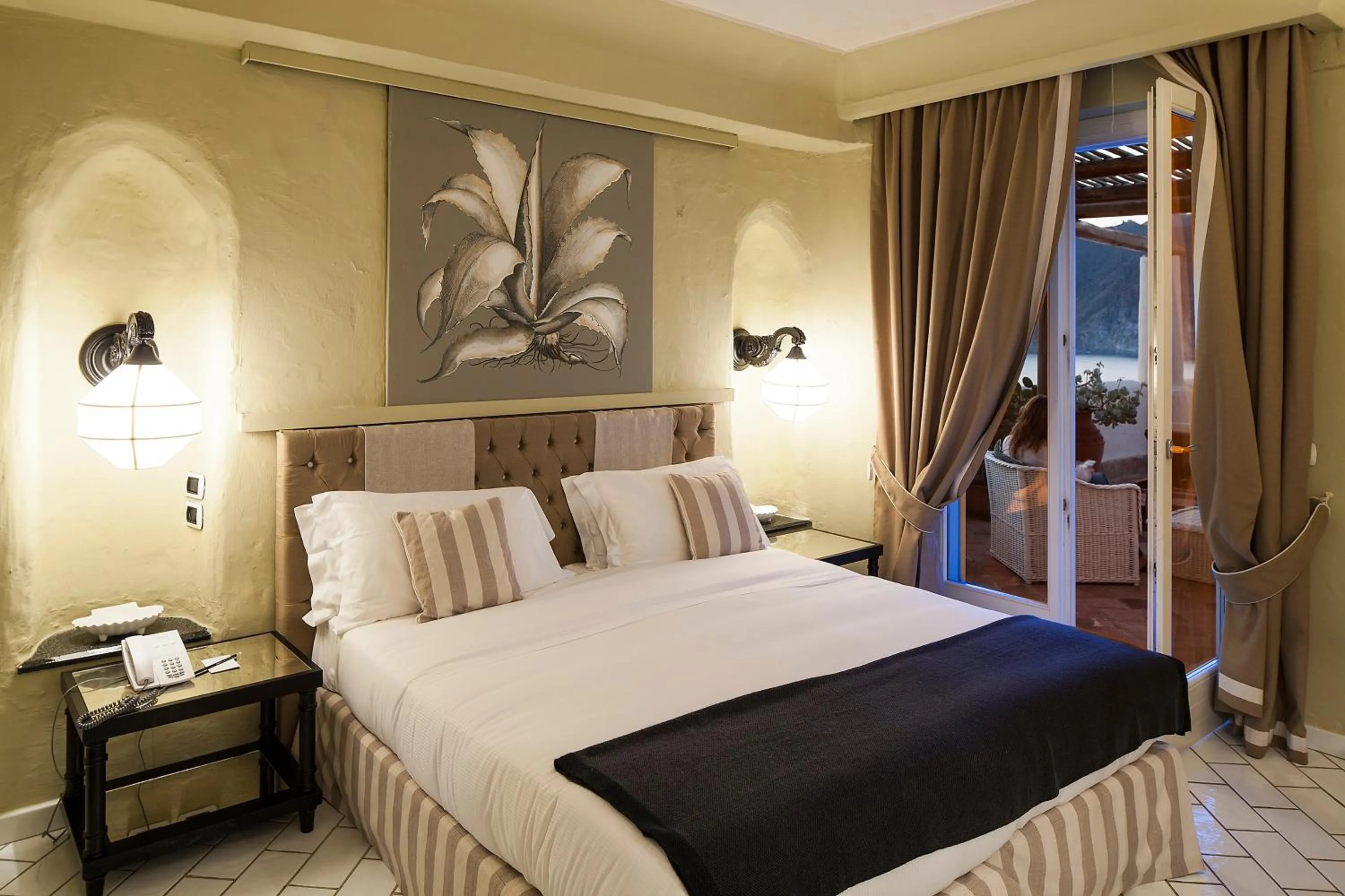 Balcony/Terrace, Bed in Therasia Resort Sea and SPA - The Leading Hotels of the World