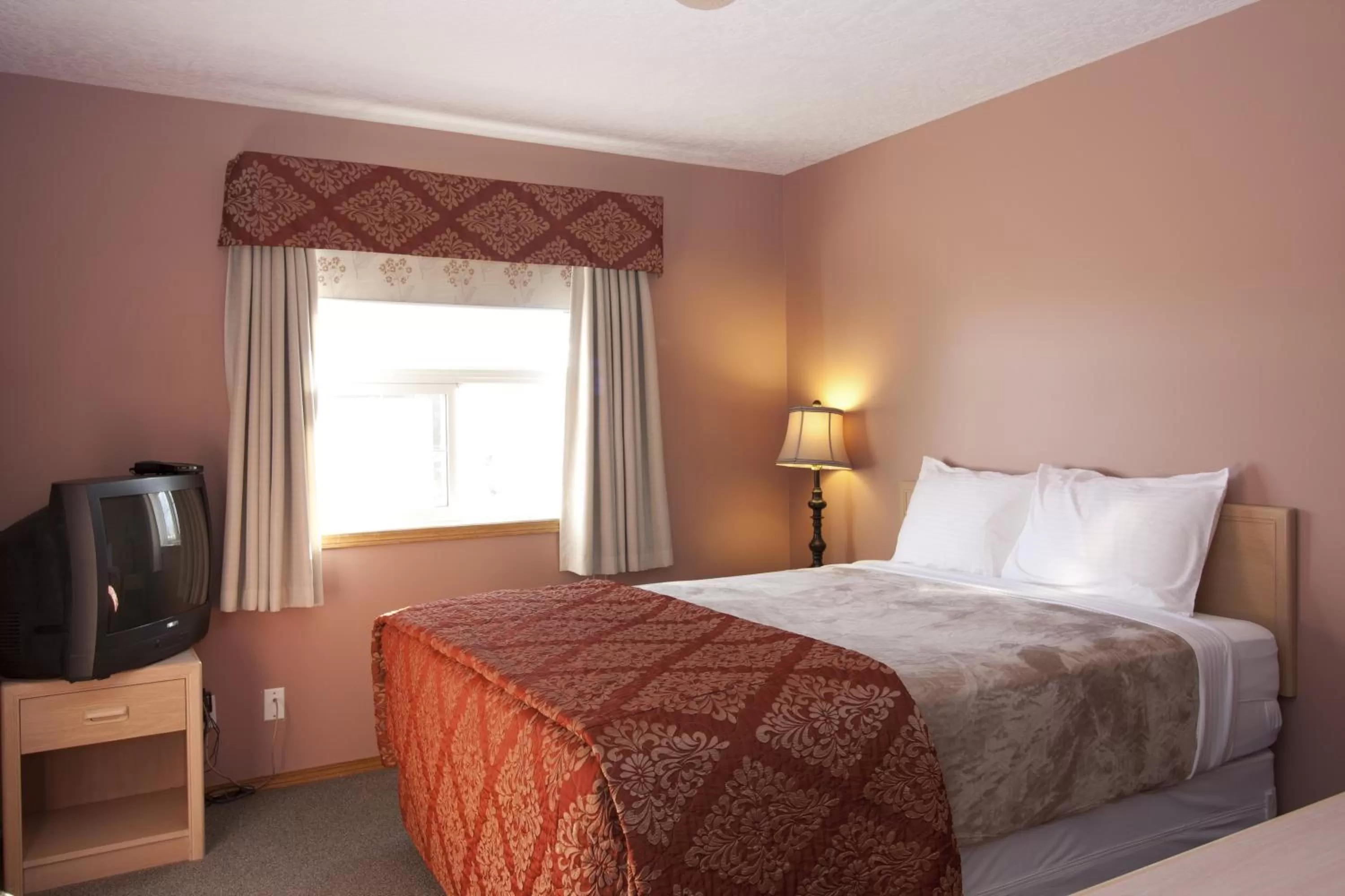 Bed in Bow River Inn