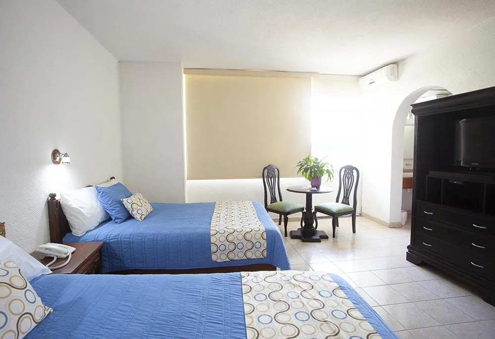 Communal lounge/ TV room, Bed in Hotel Palacio