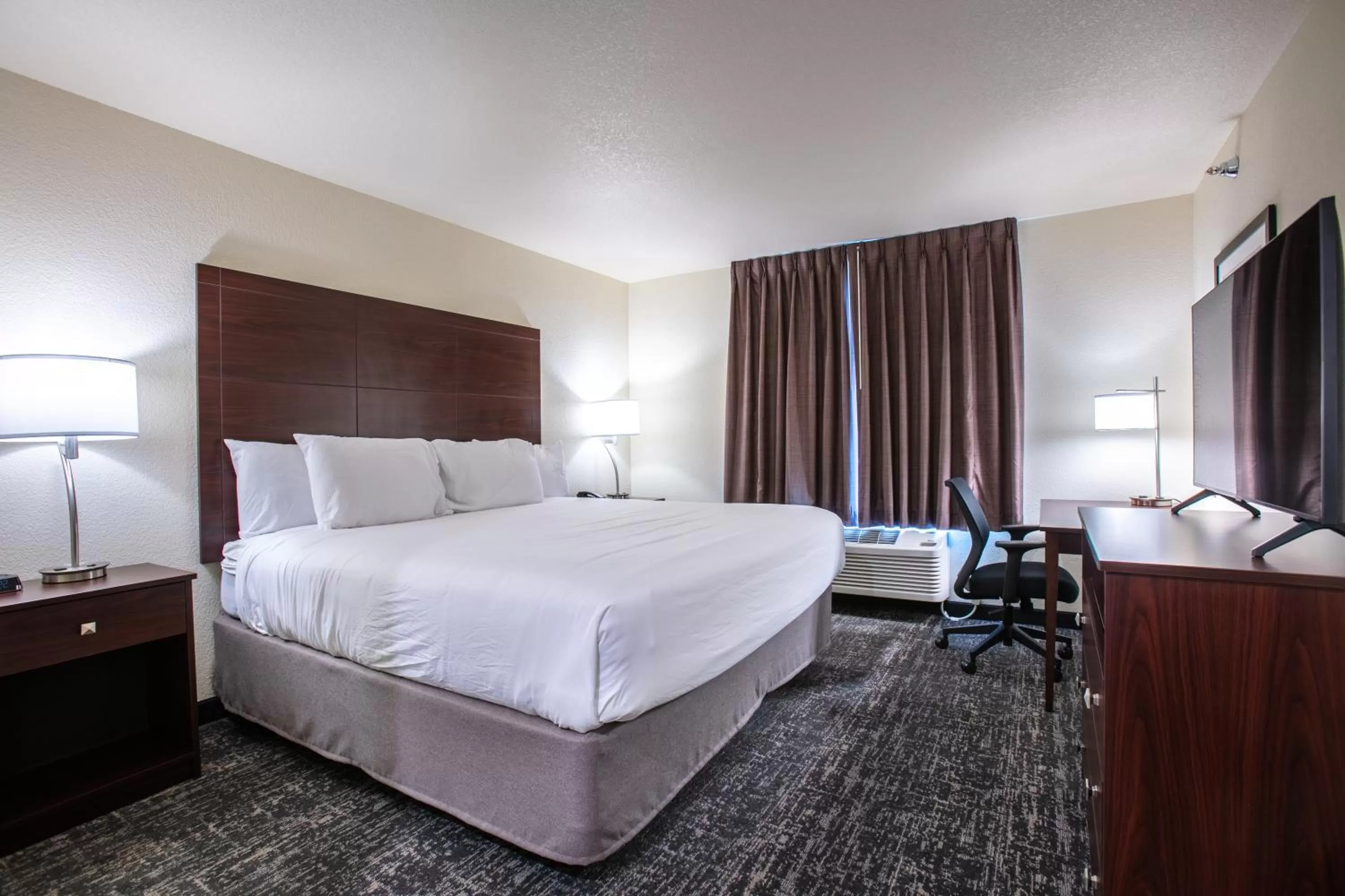 Bed in Cobblestone Inn & Suites - Pine Bluffs