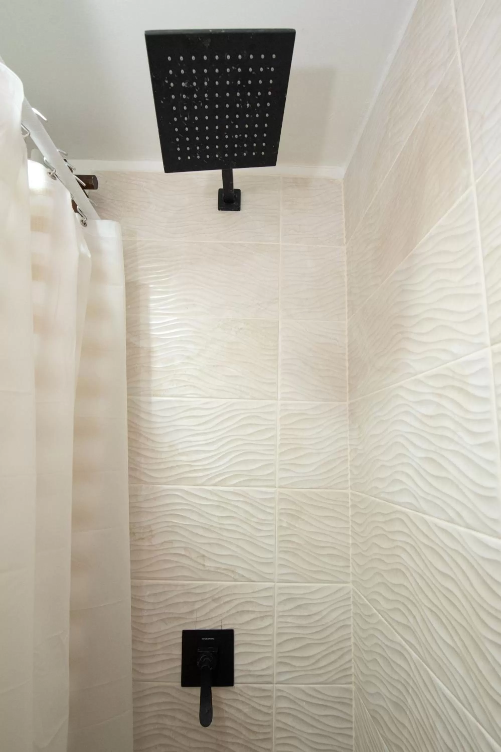 Shower in La Casa de Paz Hotel