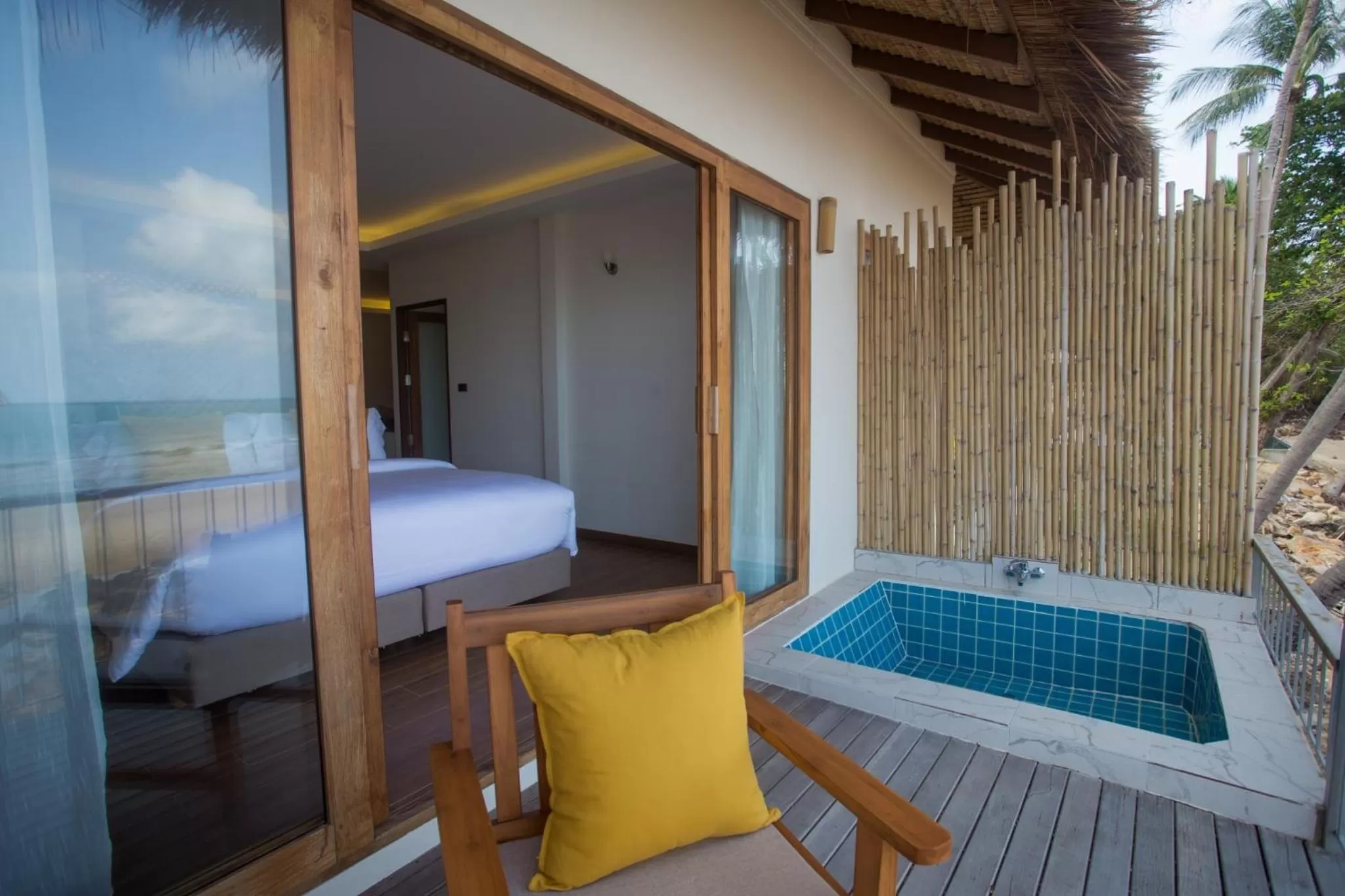 Bed in The Nest Private Beach Resort