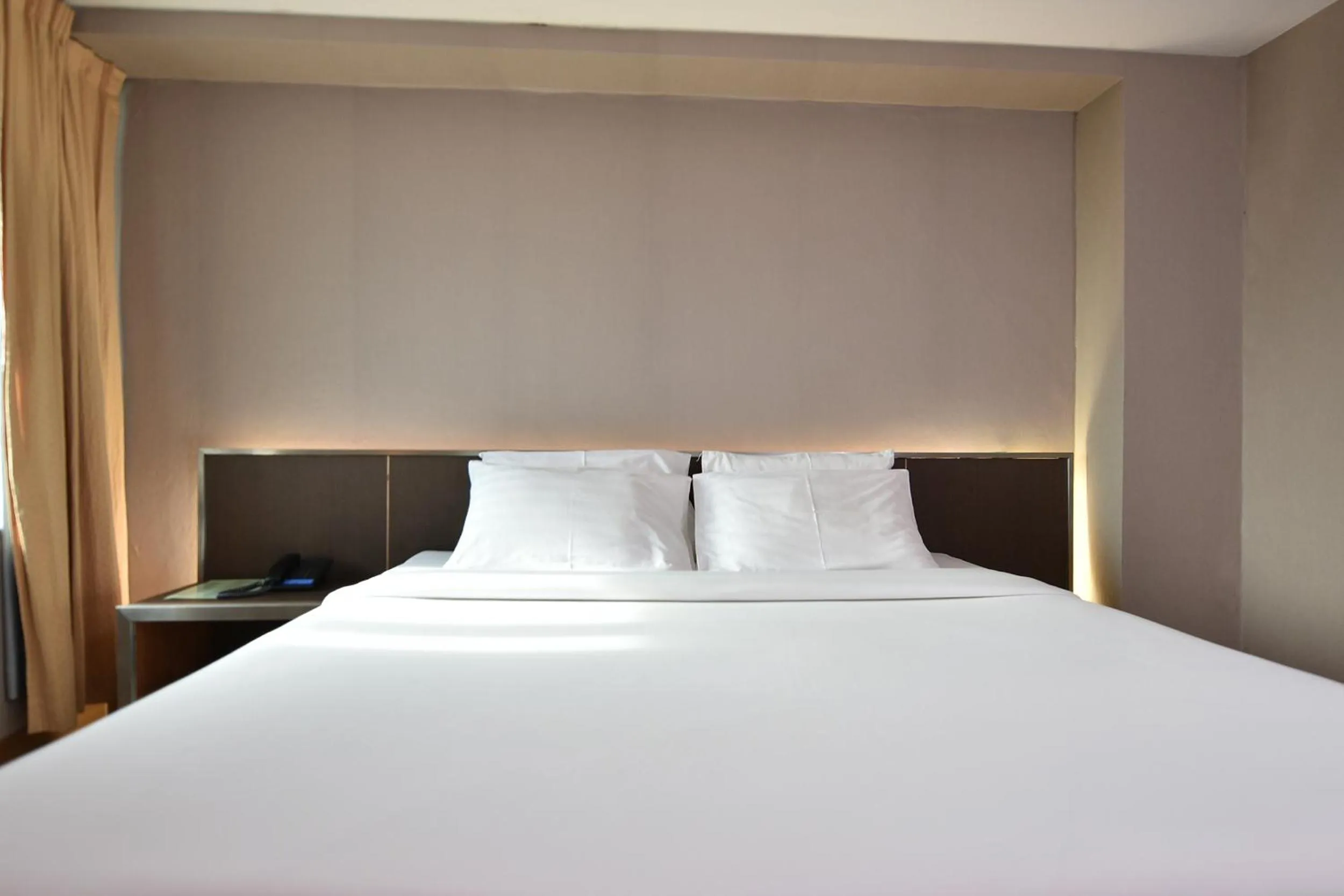 Bed in Bangkok City Suite