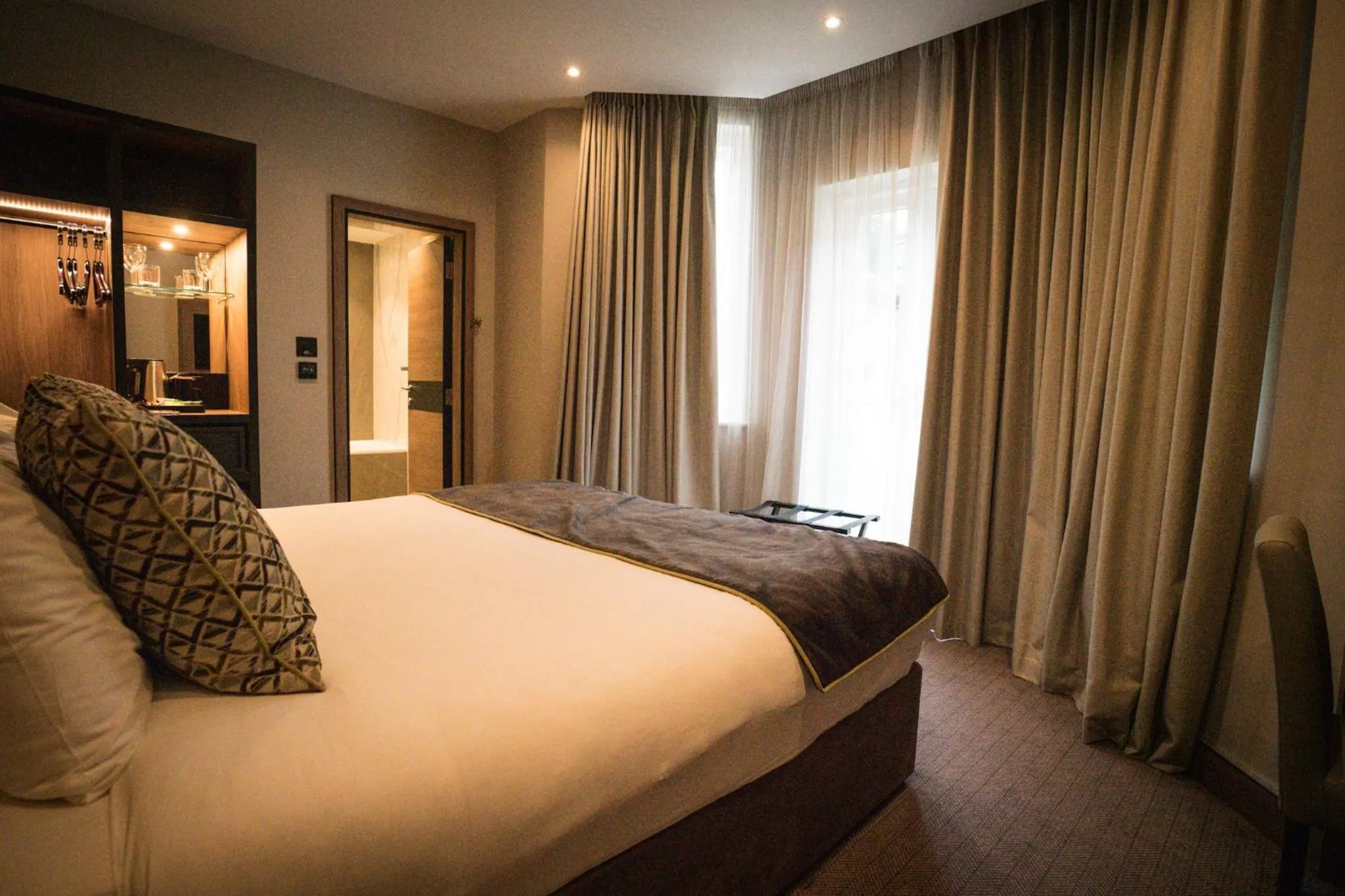 Bed in Merit Kensington Hotel