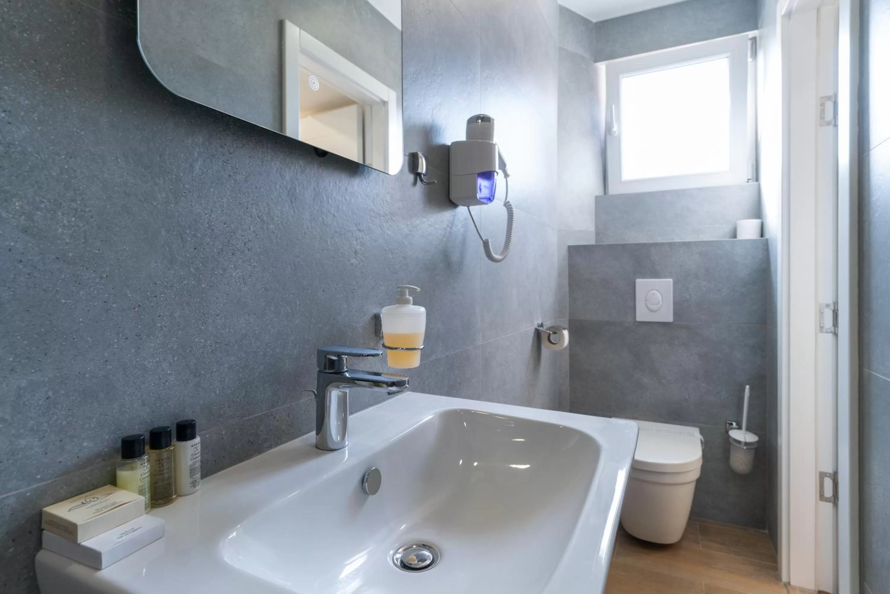 Toilet in Ornament Hotel and Apartments