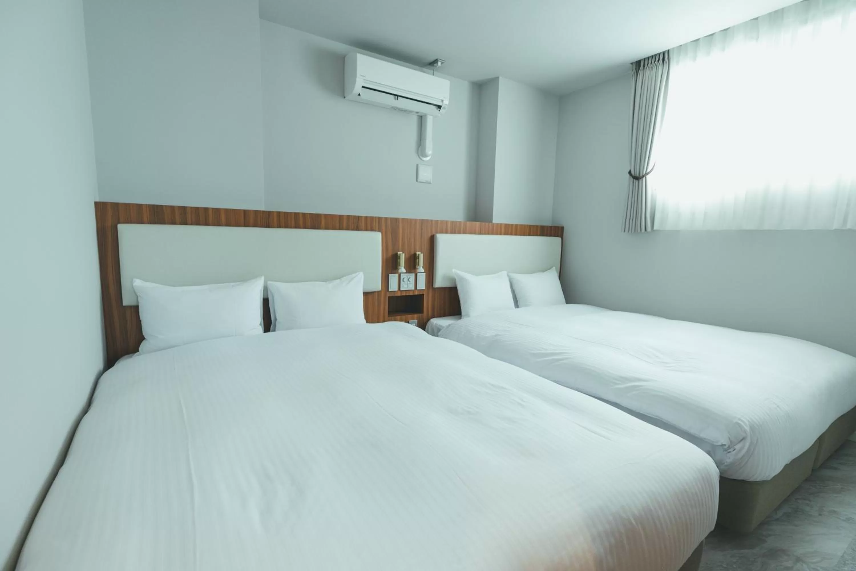 Bed in Liberated HOTEL Haruyoshi Kaichi