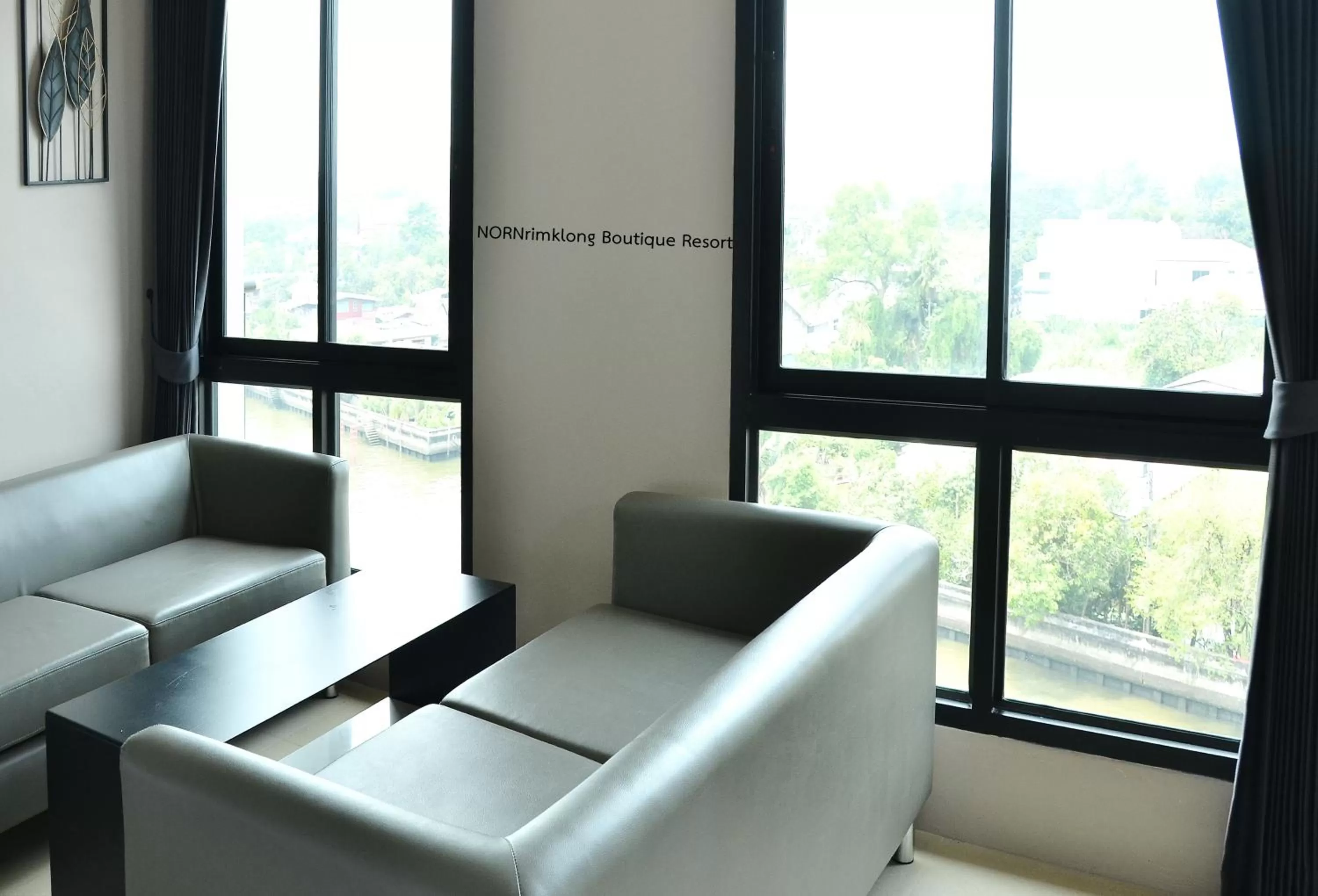 Living room in NORN Rimklong Bangkok Hotel