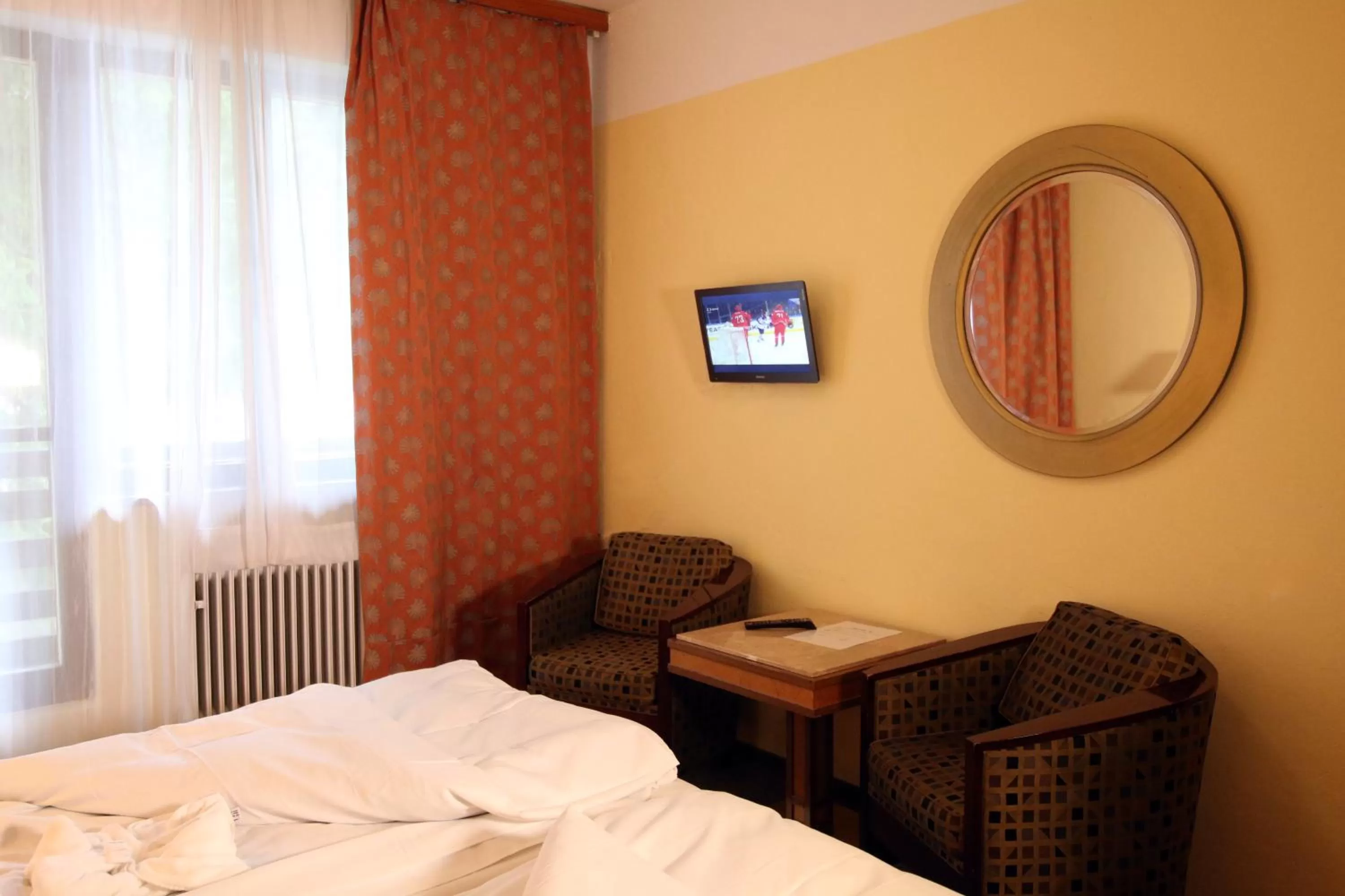 Seating area, Bed in Hotel Medlov