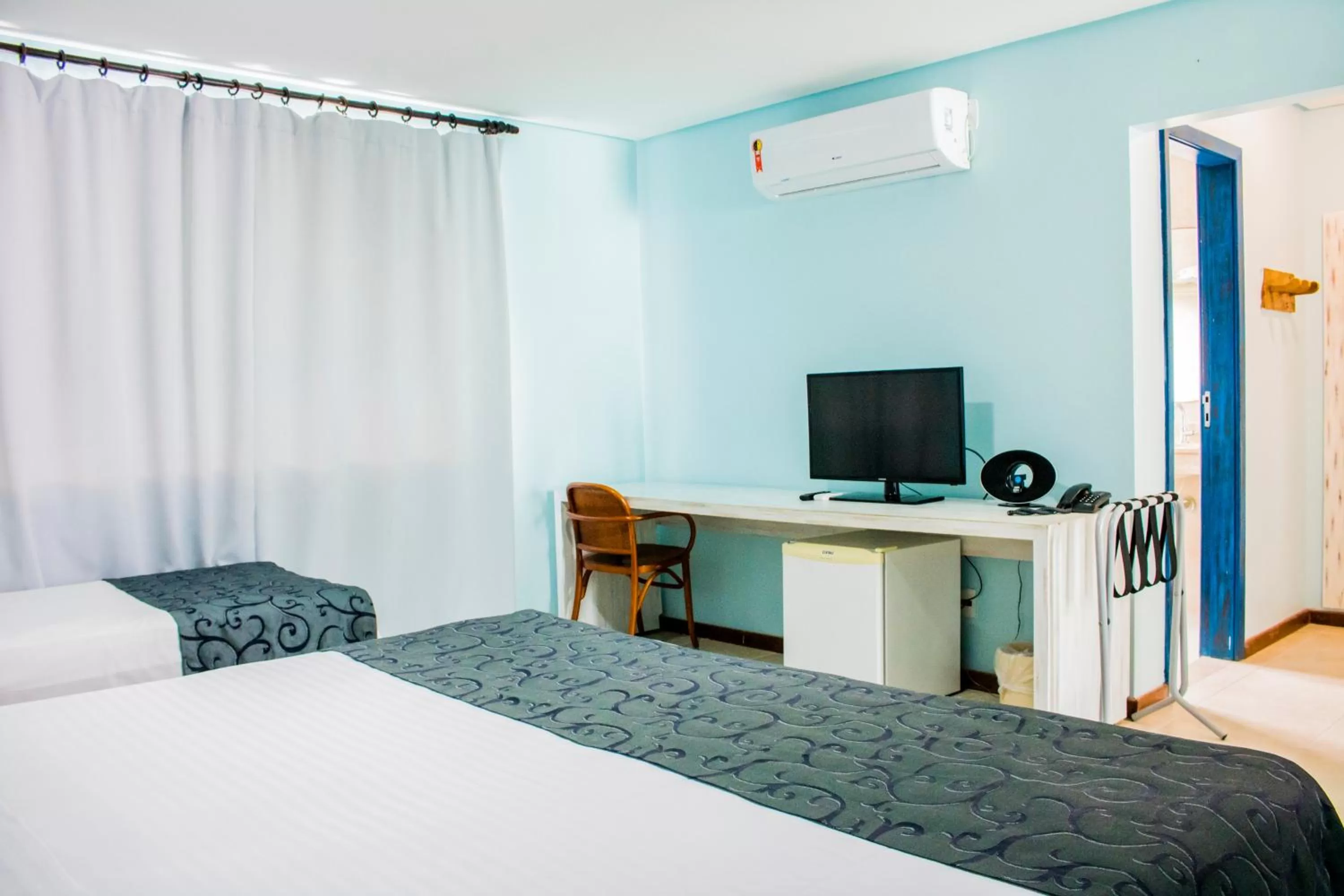 Bed in Farol de Itapuã Praia Hotel