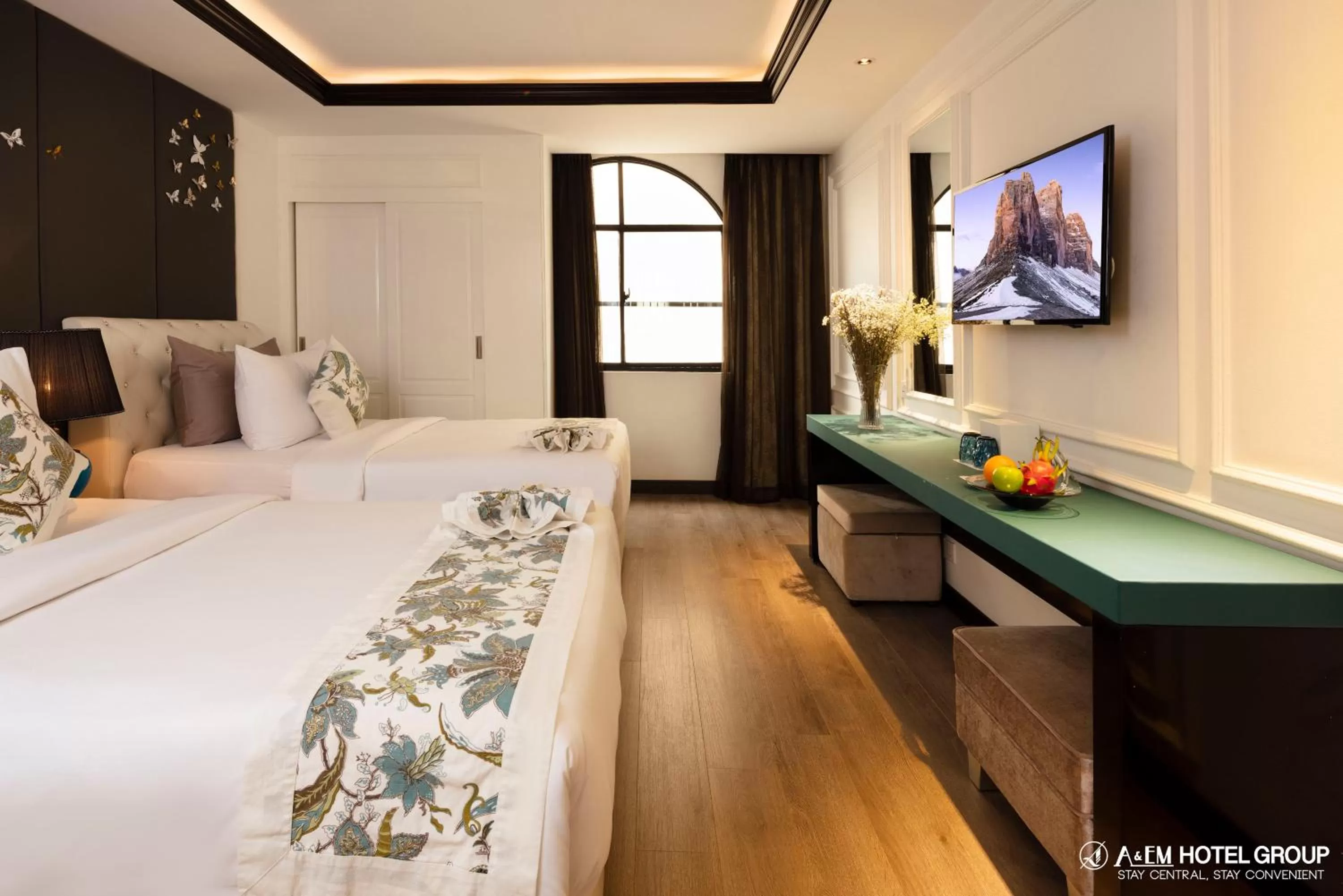 Bed in A&EM Saigon Hotel