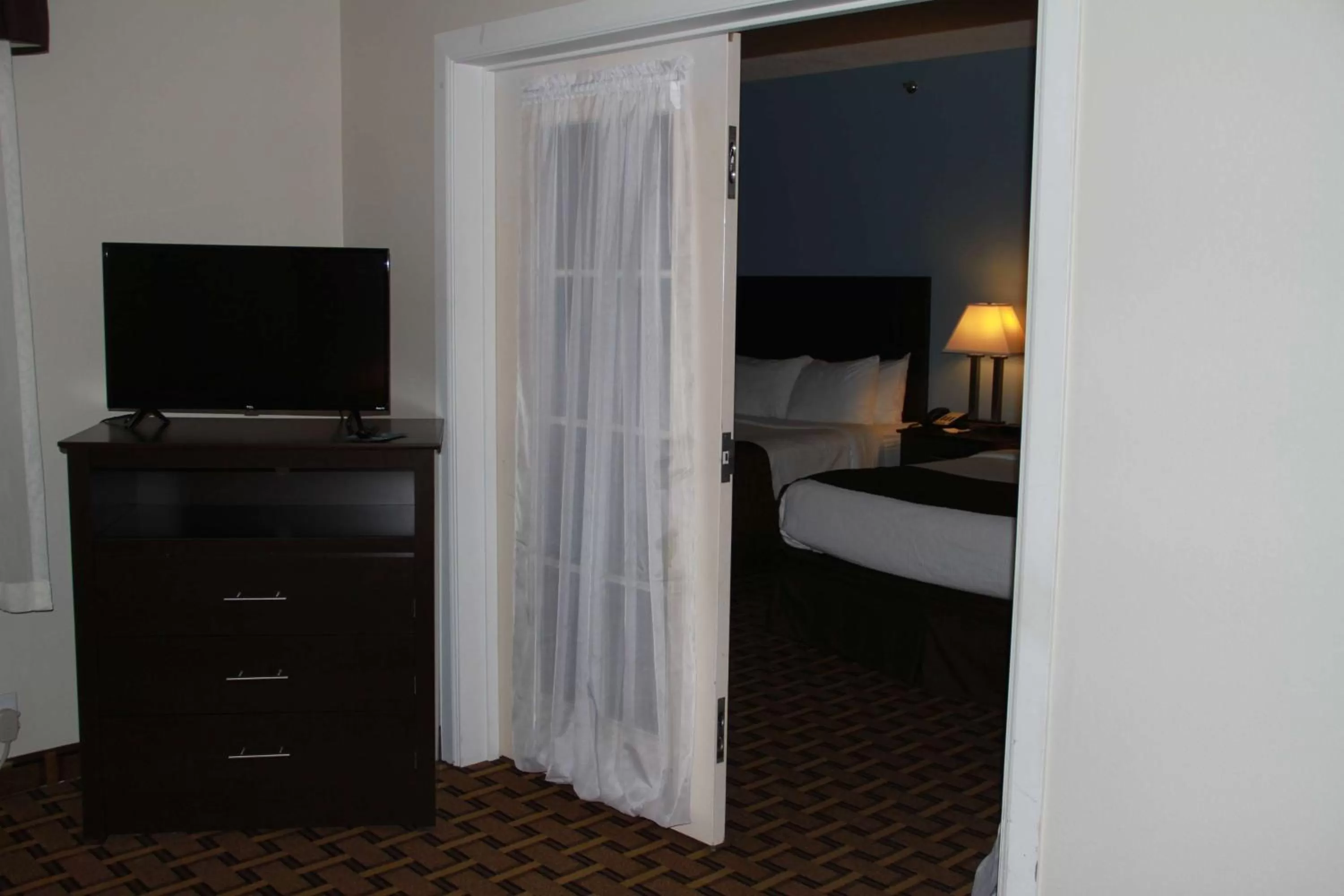 Photo of the whole room, Bed in SureStay Plus Hotel by Best Western Coralville Iowa City