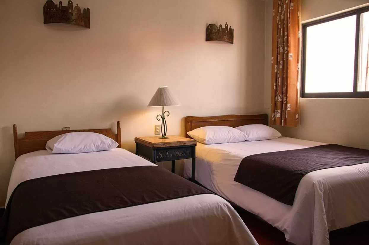 Bed in Hotel Posada Santa Bertha