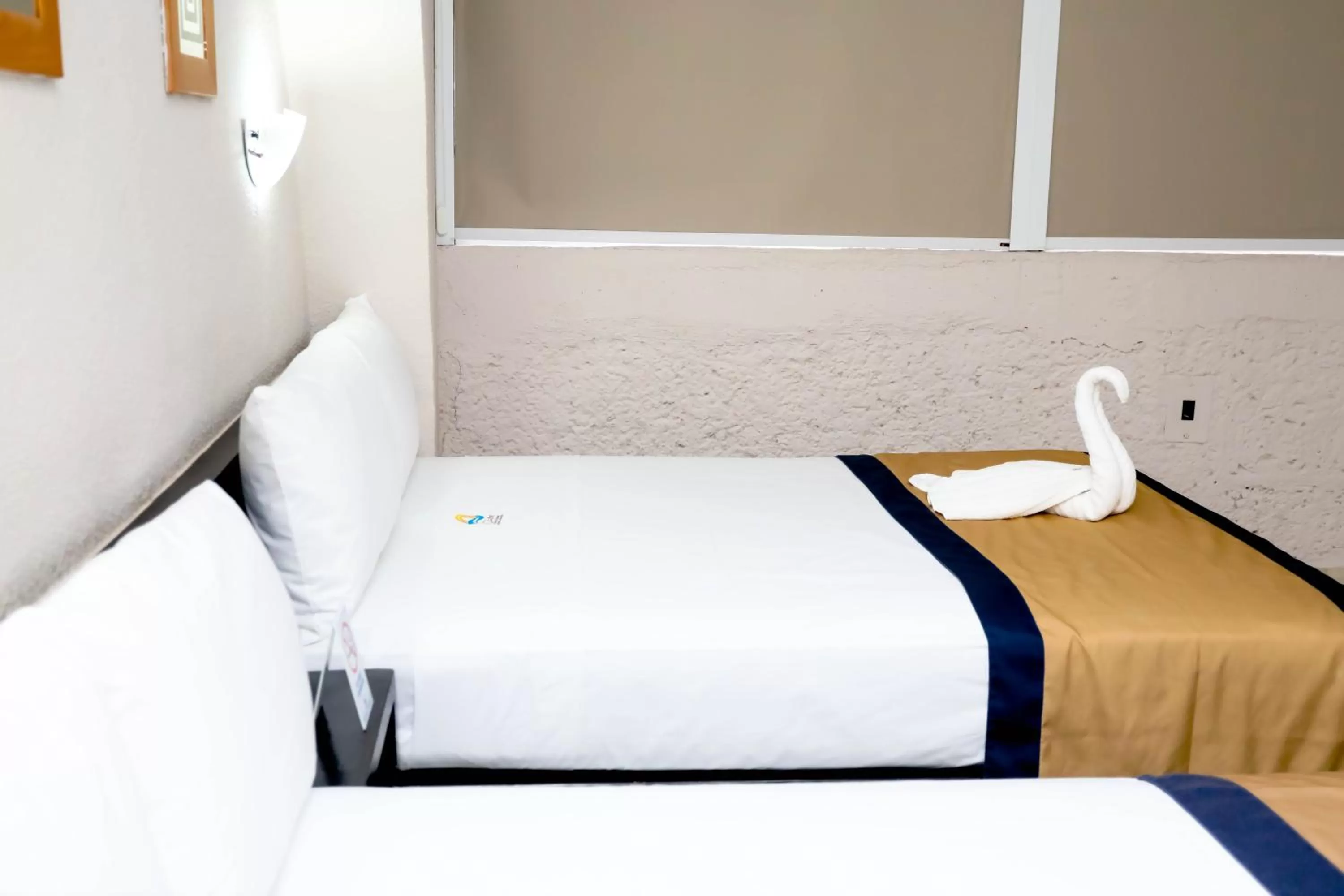 Bed in Hotel Caribe Internacional Cancun