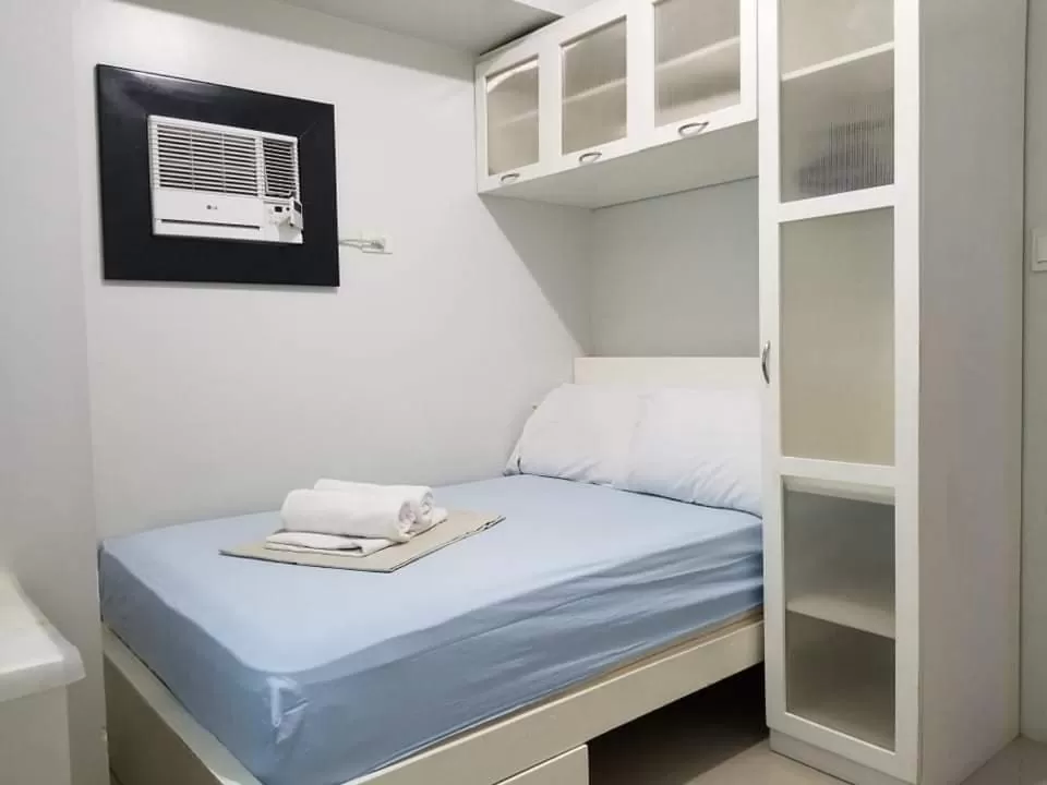 Bed in Sea Residences Homey Condo by DNJ