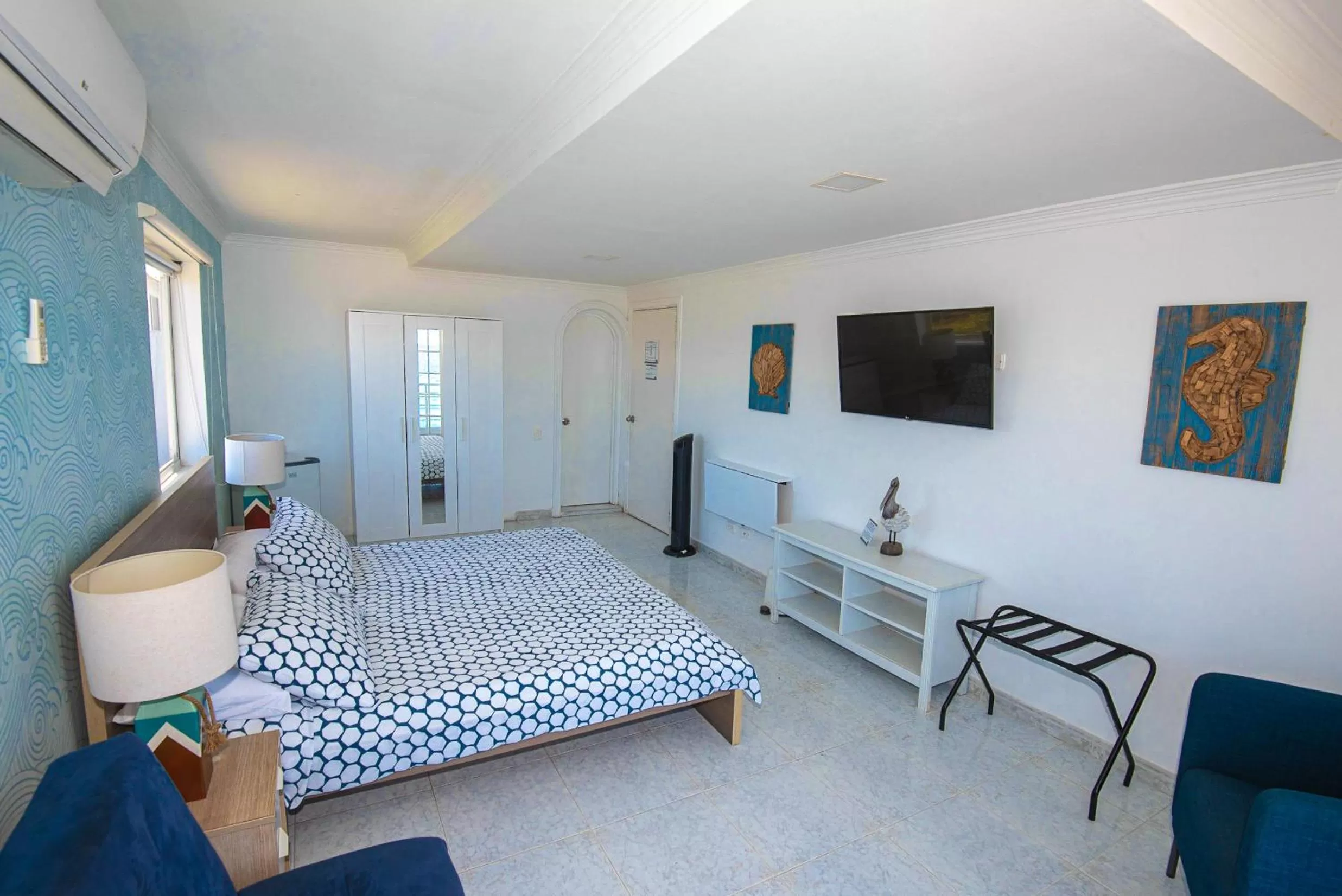 Photo of the whole room, TV/Entertainment Center in By The Sea Guest House