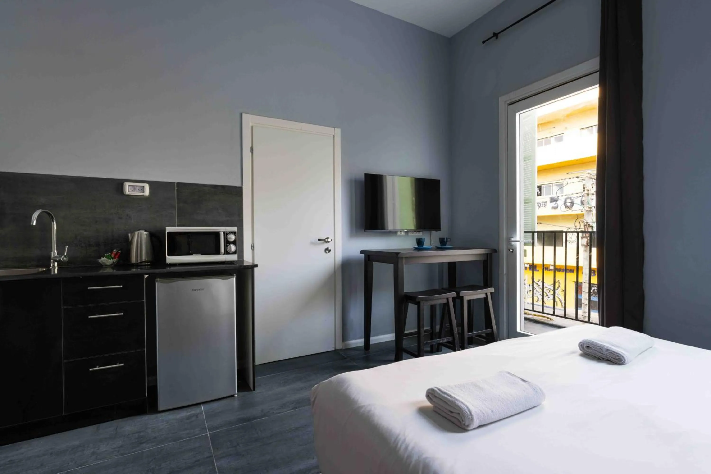 Photo of the whole room, Bed in Liber Tel Aviv Sea Shore Suites BY RAPHAEL HOTELS