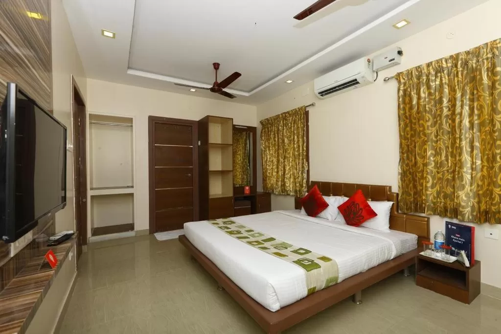 Photo of the whole room, Bed in Sri Kamadhenu Residency