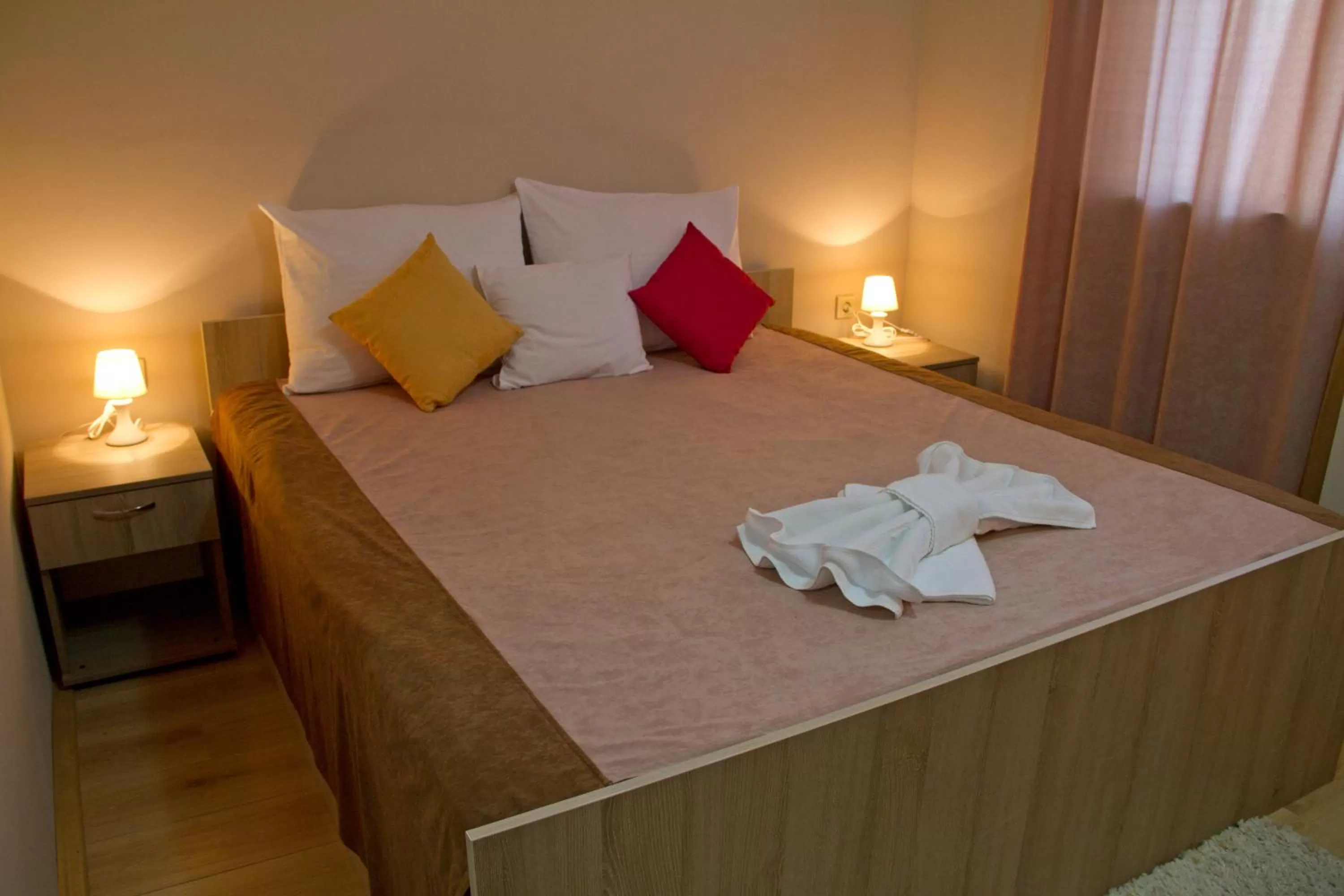 Bed in Garni Hotel Tri O