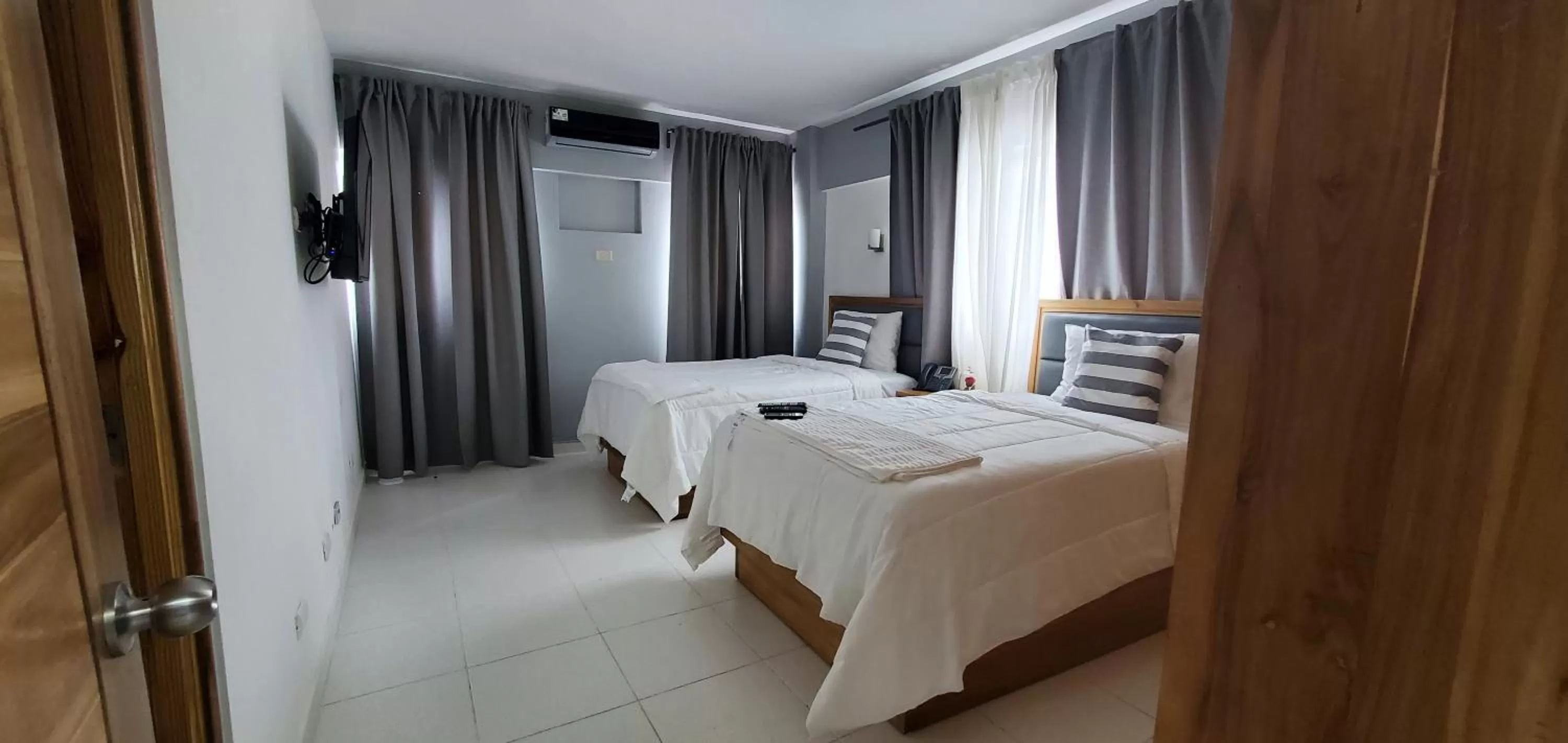 Bed in Boca Grande Hotel Suites