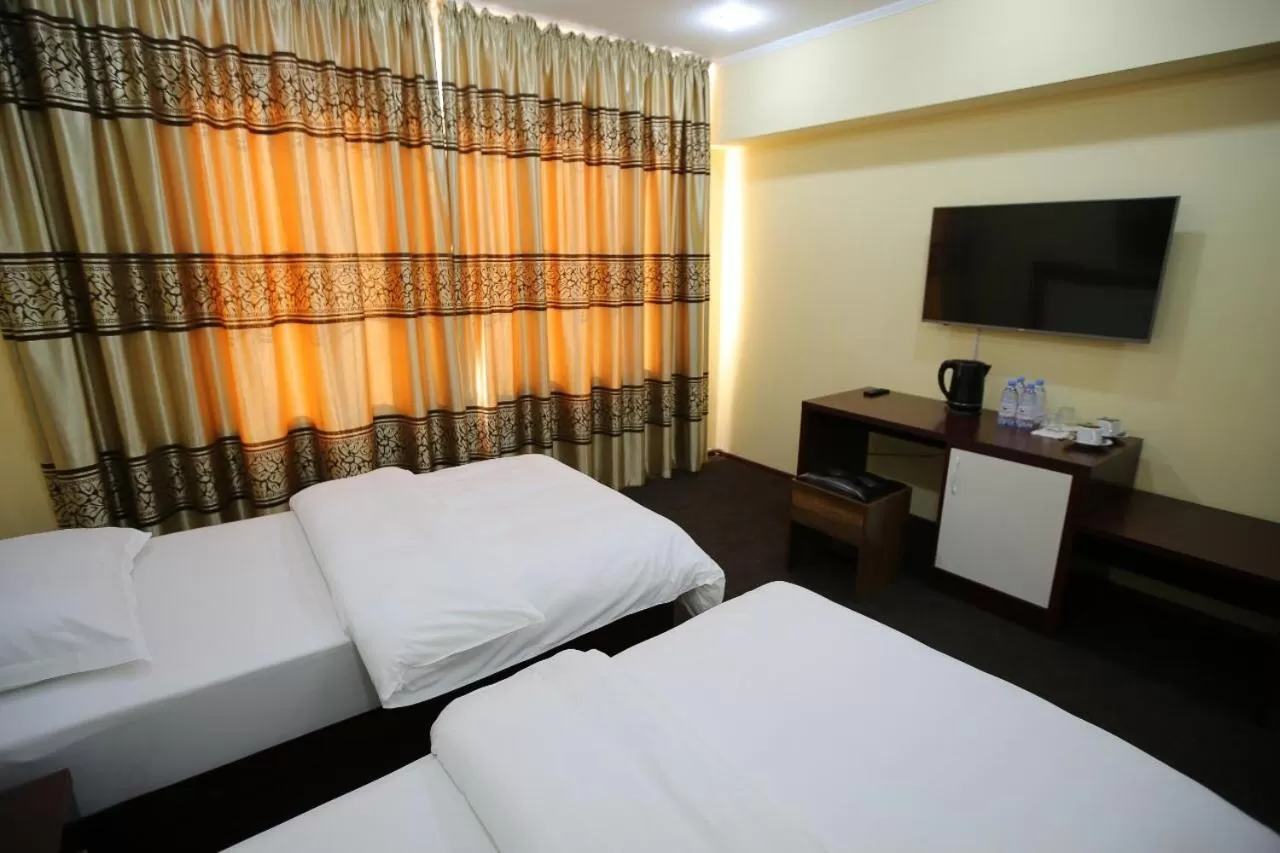 Bed in Altai Business Hotel