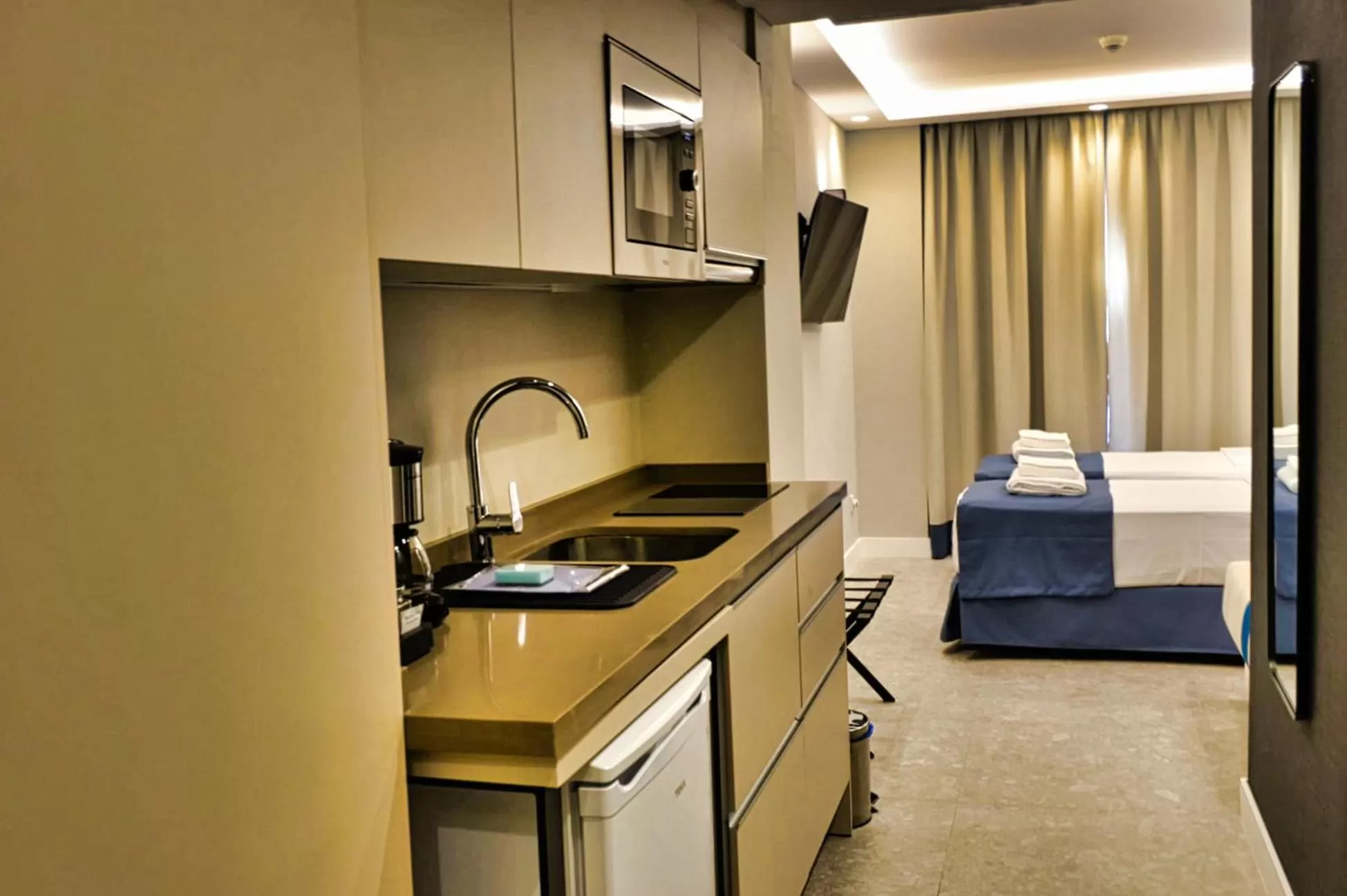 Kitchen or kitchenette, Bed in Posidonia Aparthotel