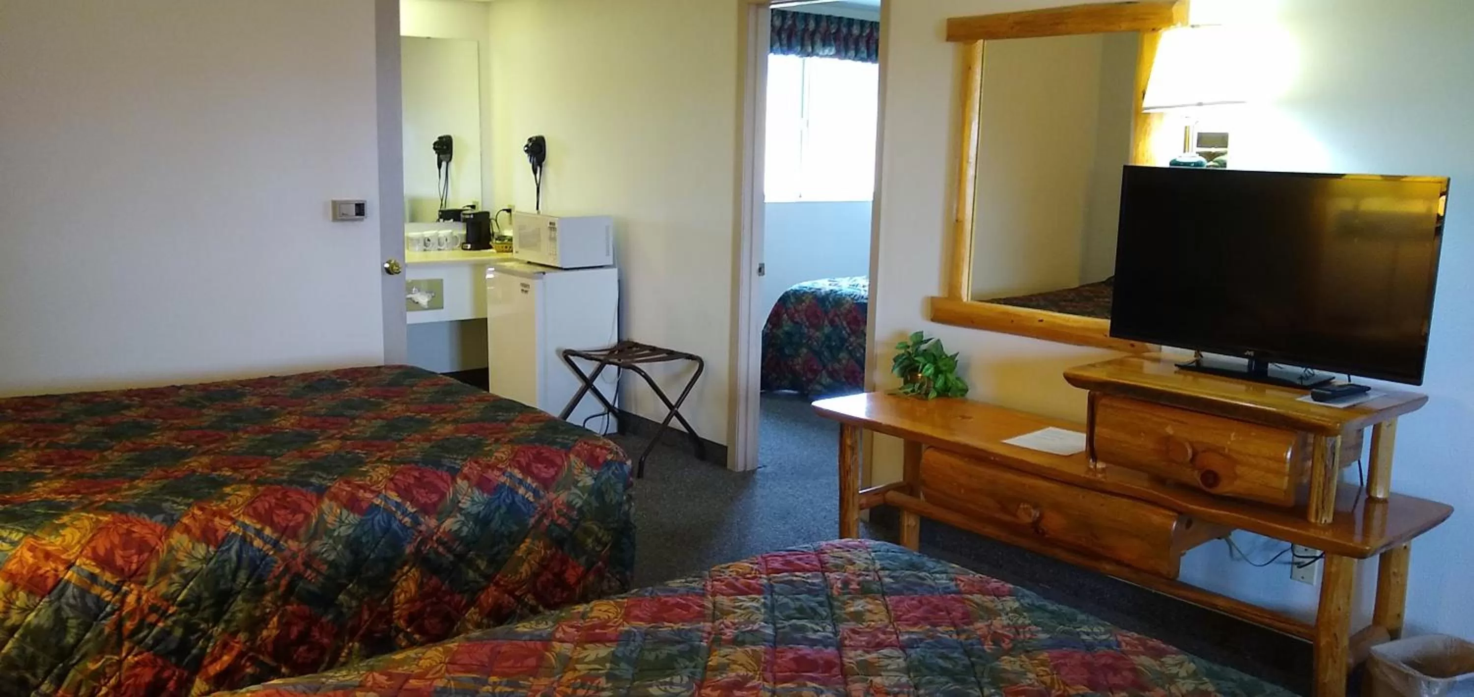 Bed in Ponderosa Motel