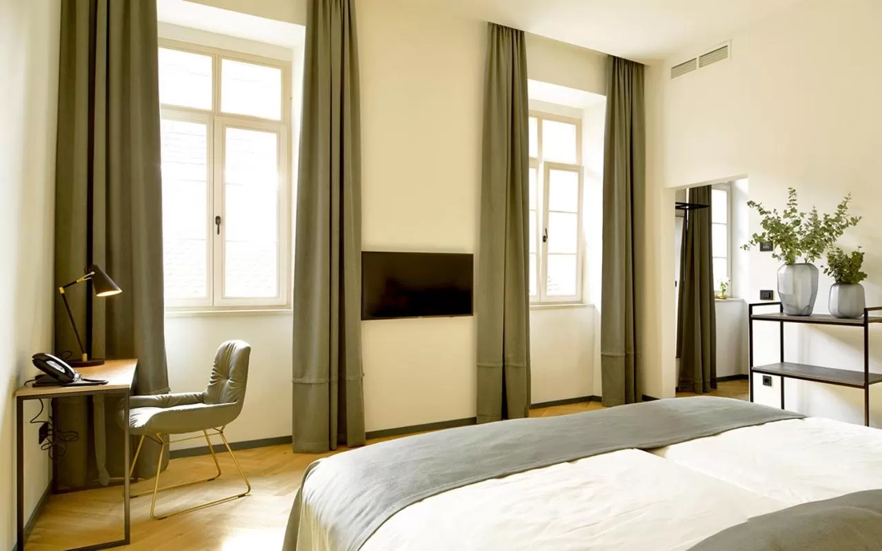 Bed in Hotel Maribor & Garden Rooms