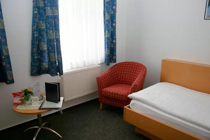 Seating area, Bed in Hotel Stadt Reinfeld