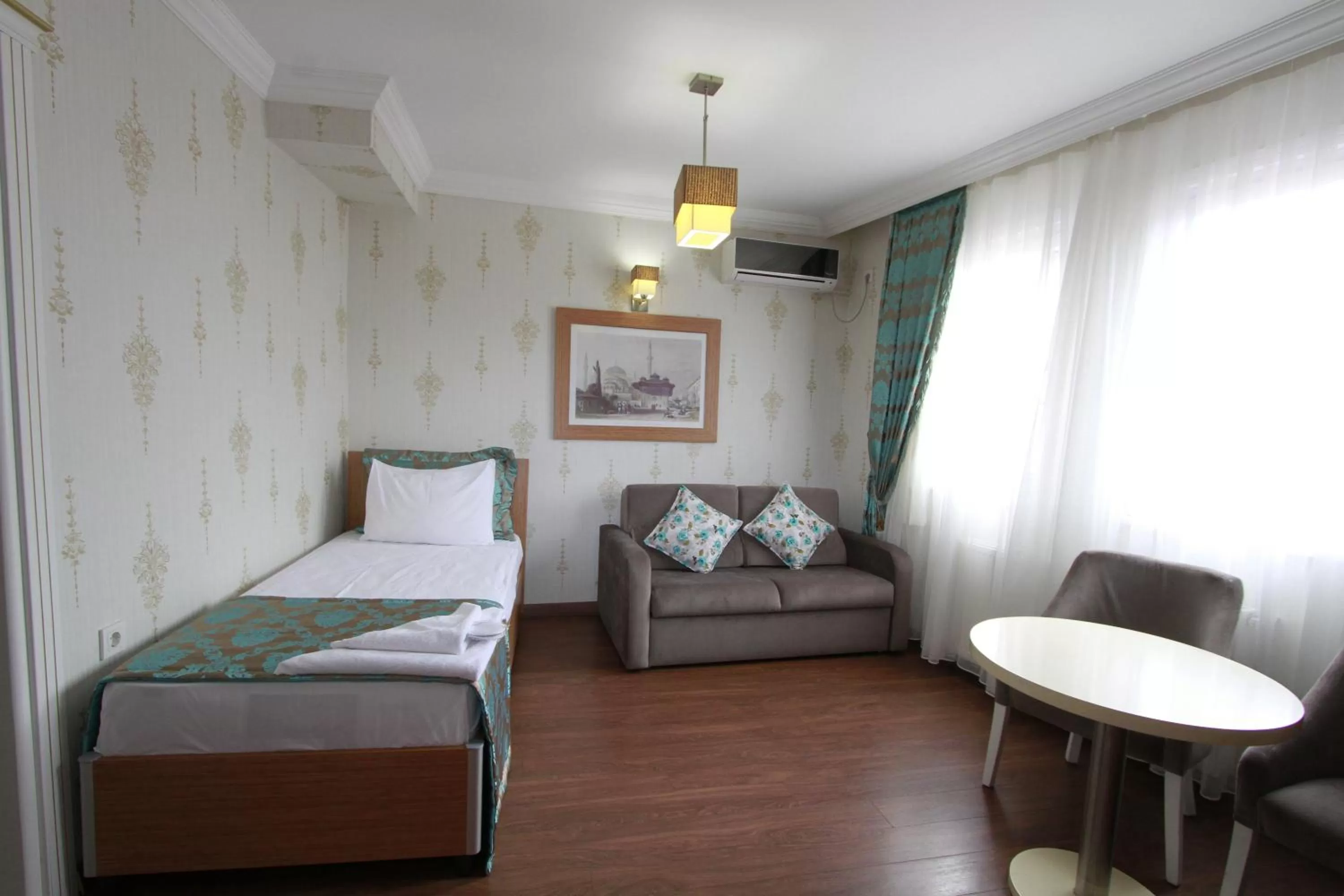 Photo of the whole room, Bed in Agora Boutique Hotel & Bistro