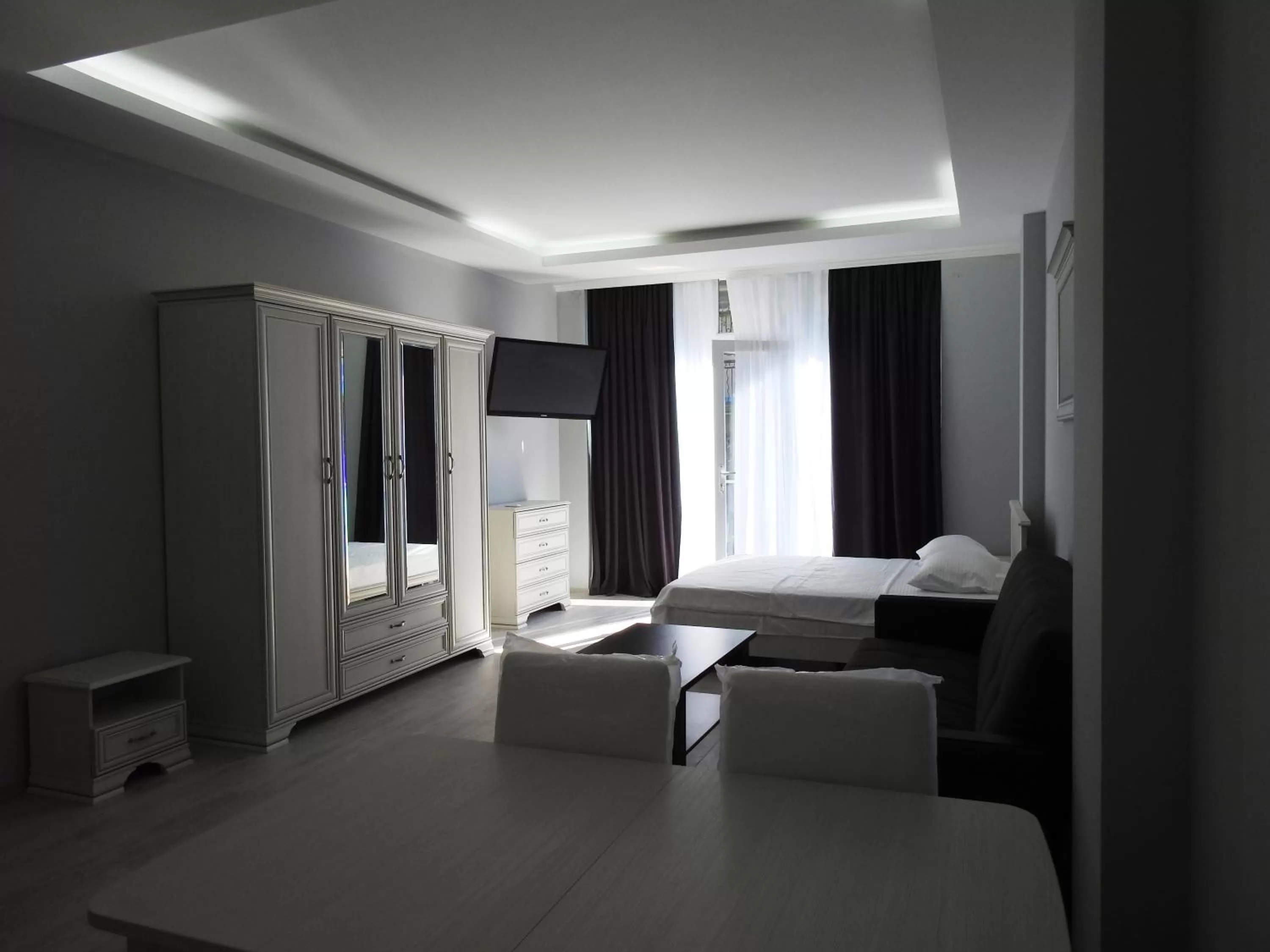 Photo of the whole room, Seating Area in Iko's Family Apartments