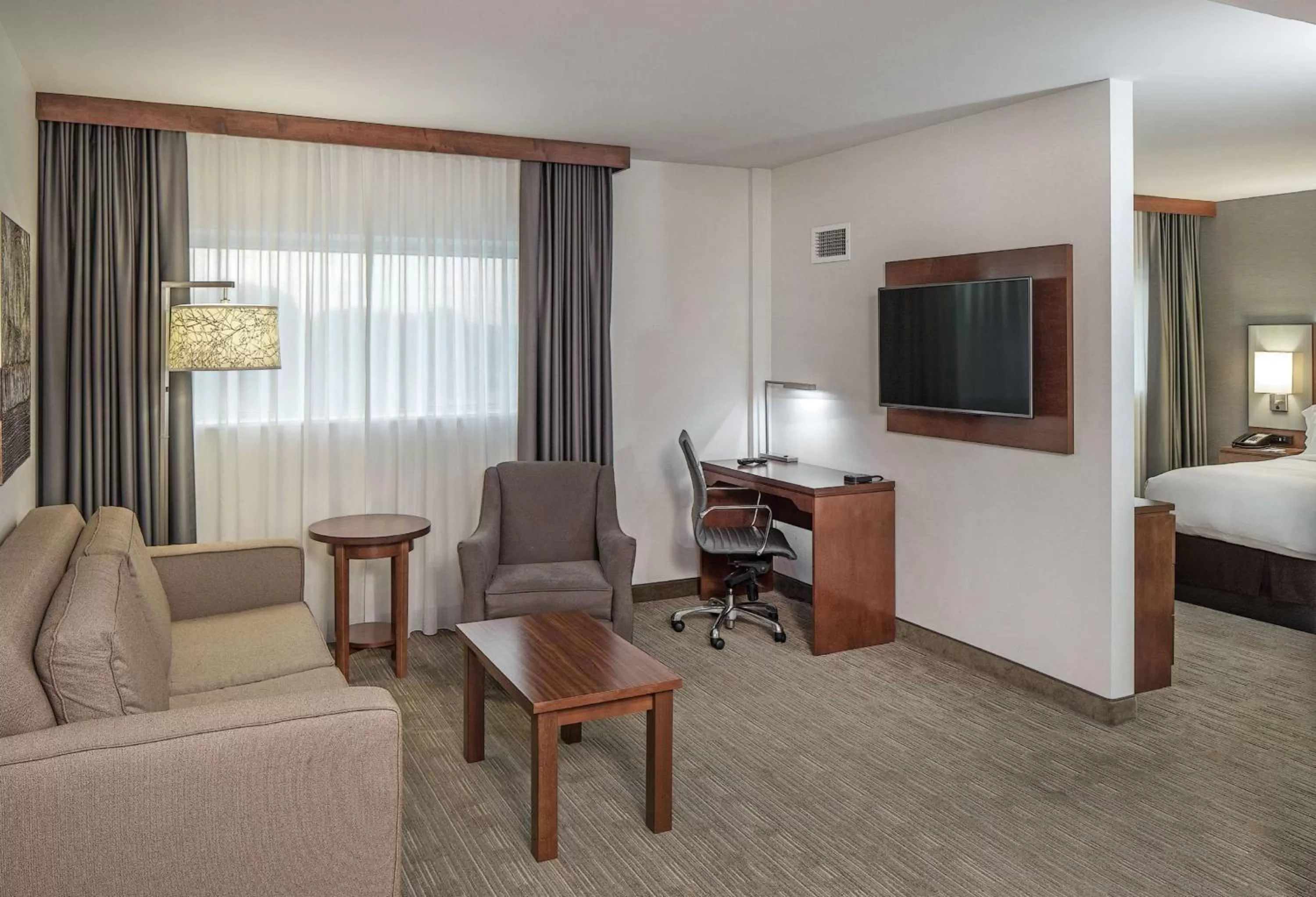 Living room, Bed in Doubletree By Hilton Omaha Southwest, Ne