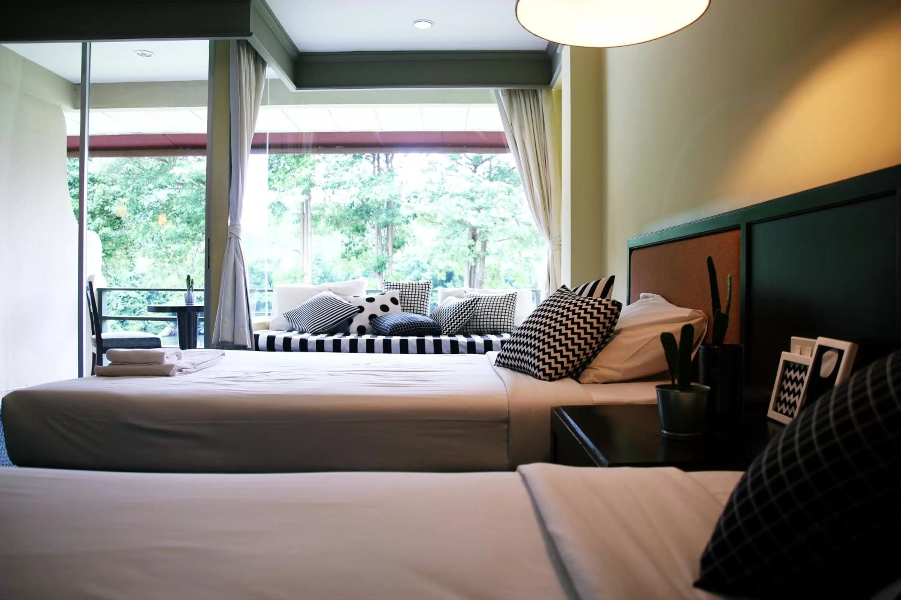 Bed in Aekpailin River Kwai Resort