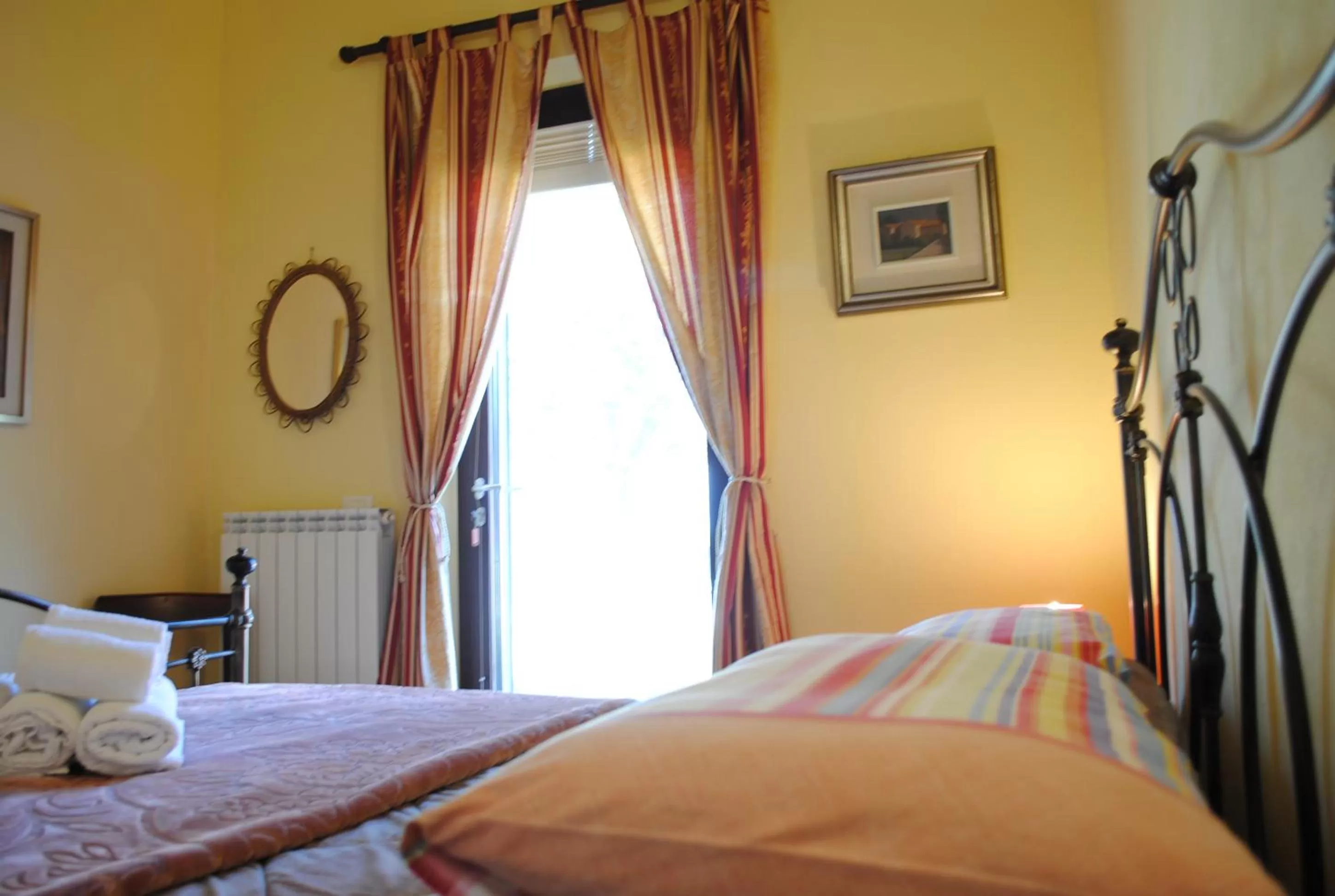 Bed in AGRITURISMO MELOGRANO D'ORO