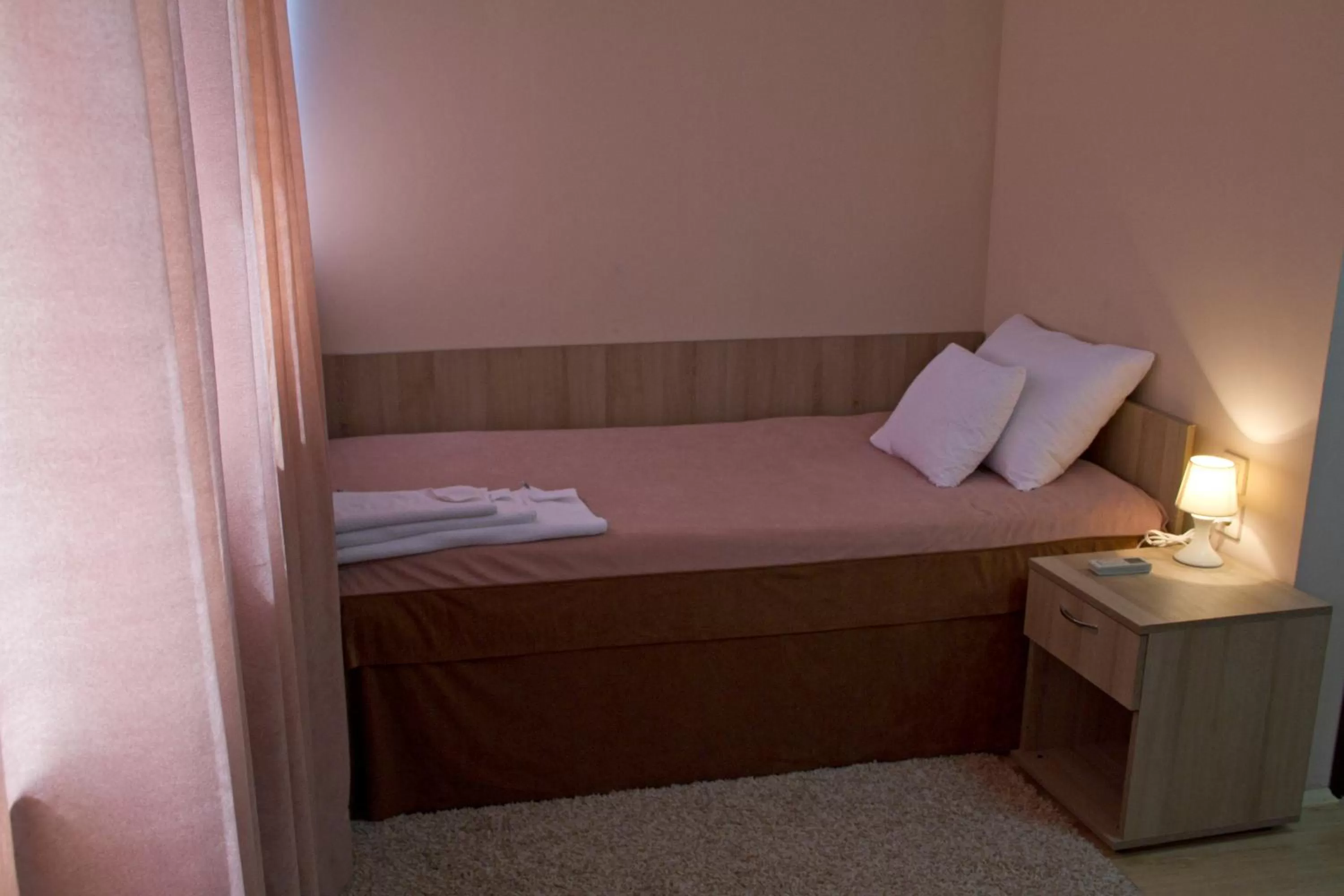 Bed in Garni Hotel Tri O