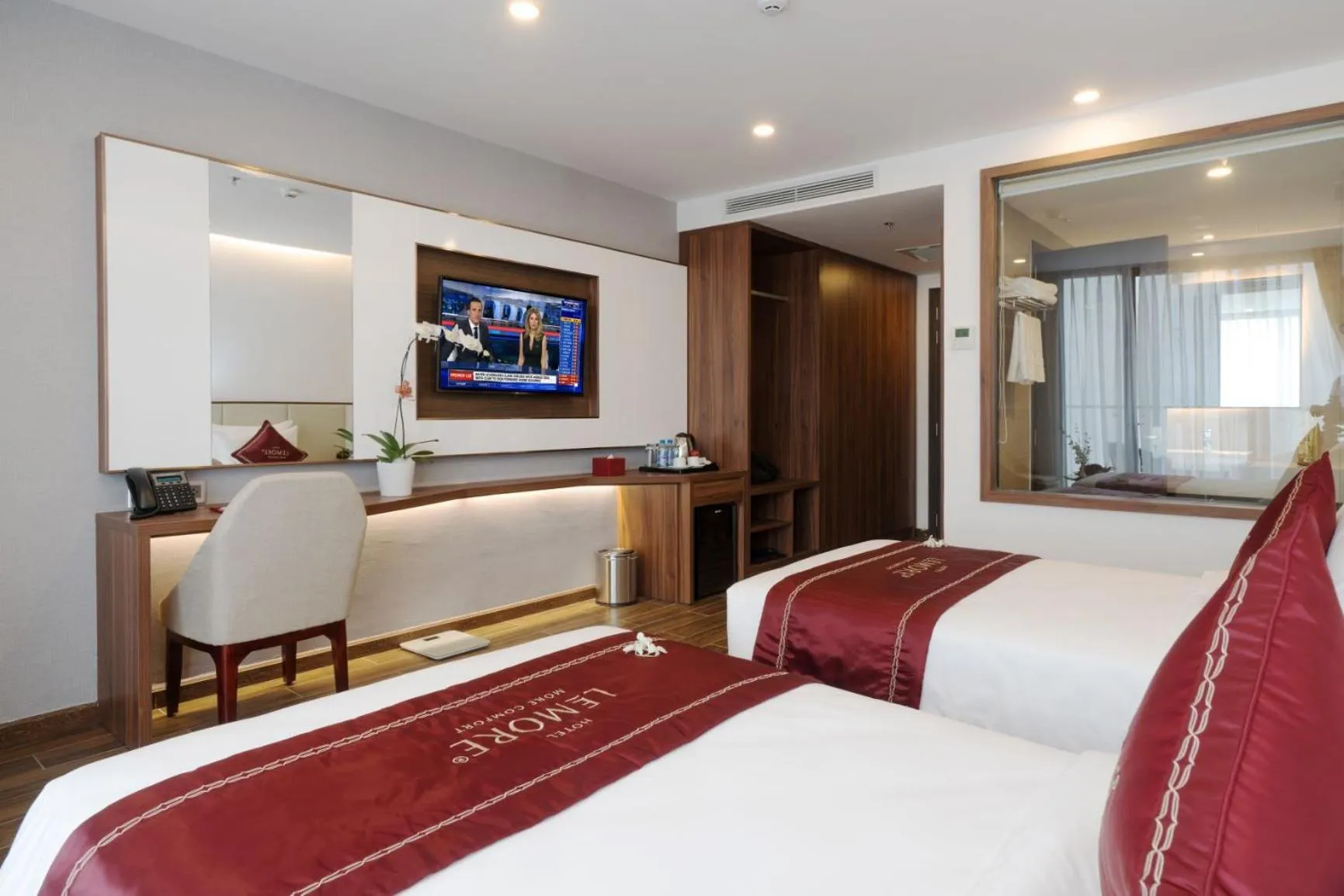 Communal lounge/ TV room, Bed in LeMore Hotel Nha Trang