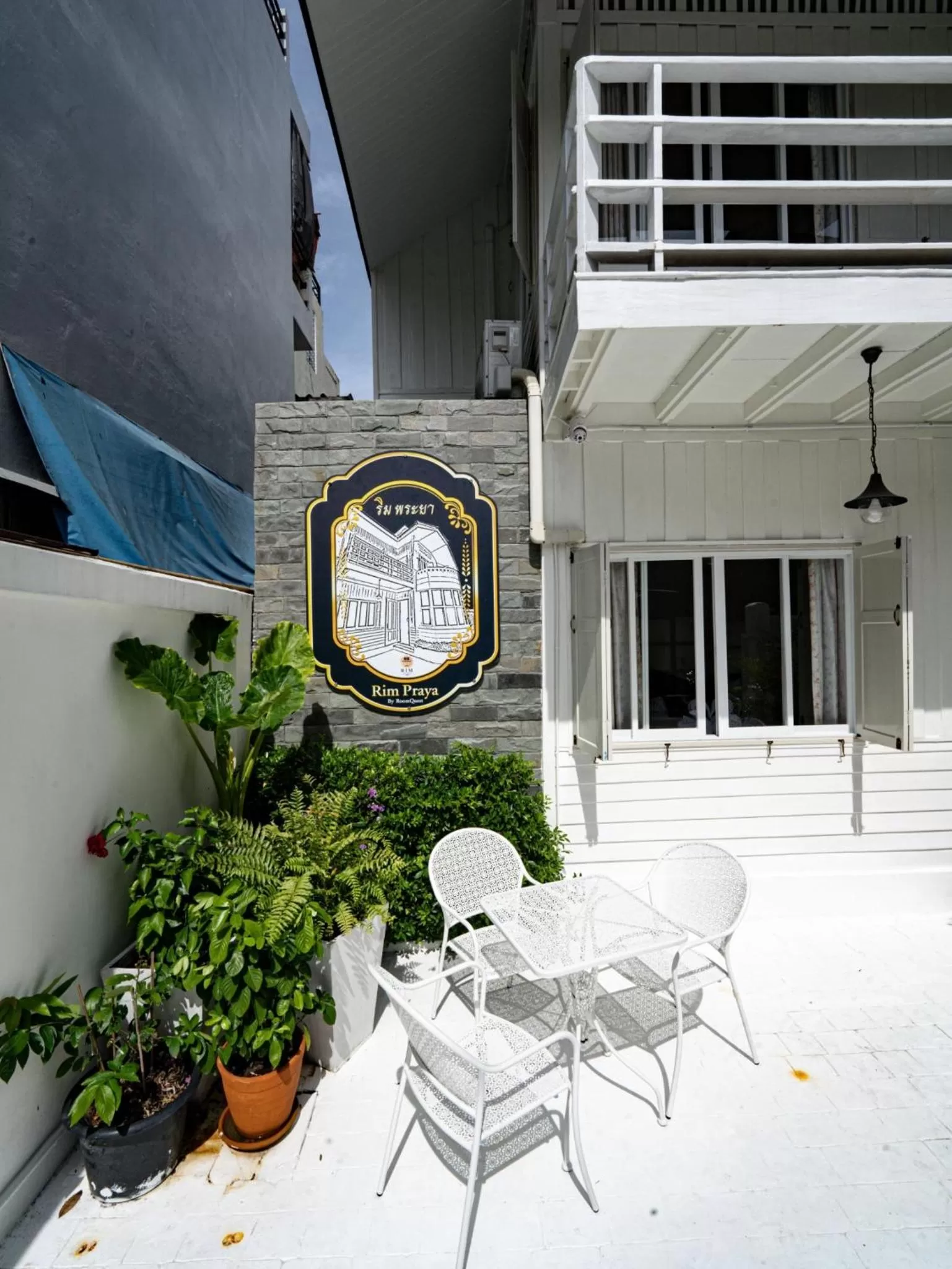 Property logo or sign in RoomQuest Rim Praya Dinsor Road